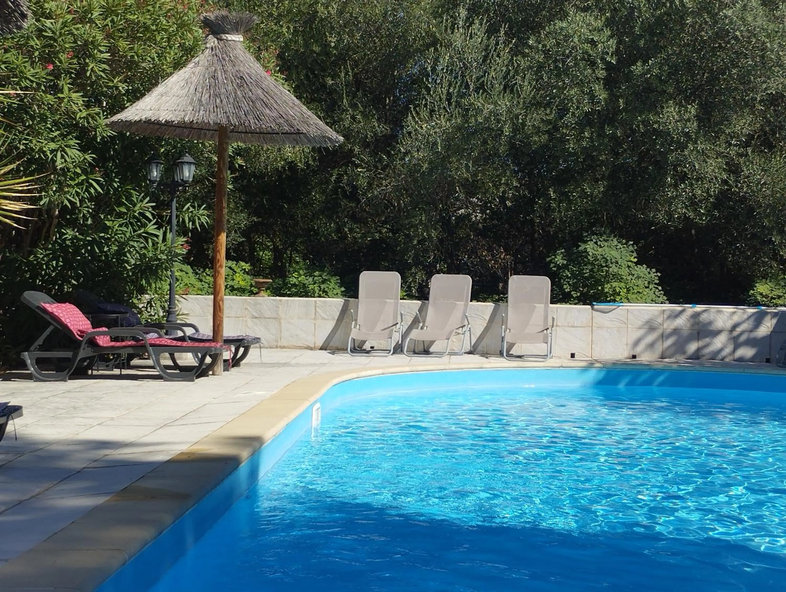 Swimming pool in Logis Hotel Restaurant L'Esquielle