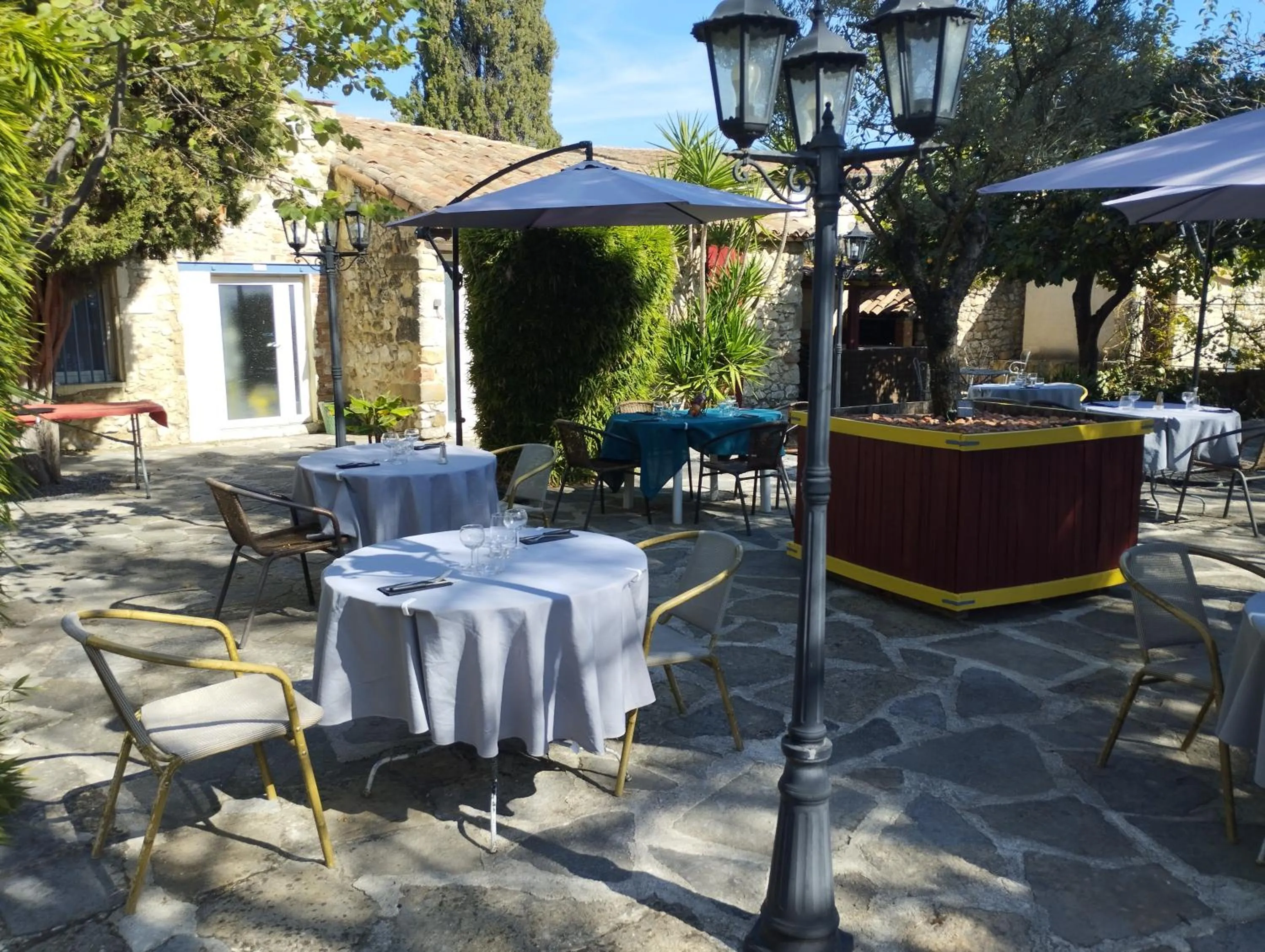 Patio in Logis Hotel Restaurant L'Esquielle
