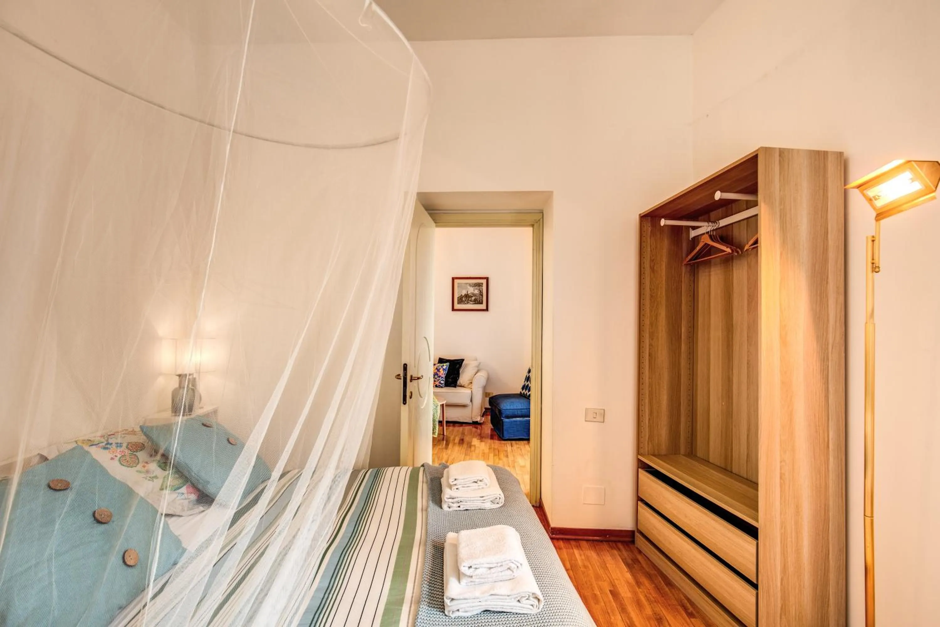 Photo of the whole room, Bed in Elegant Apartment Behind the Colosseum