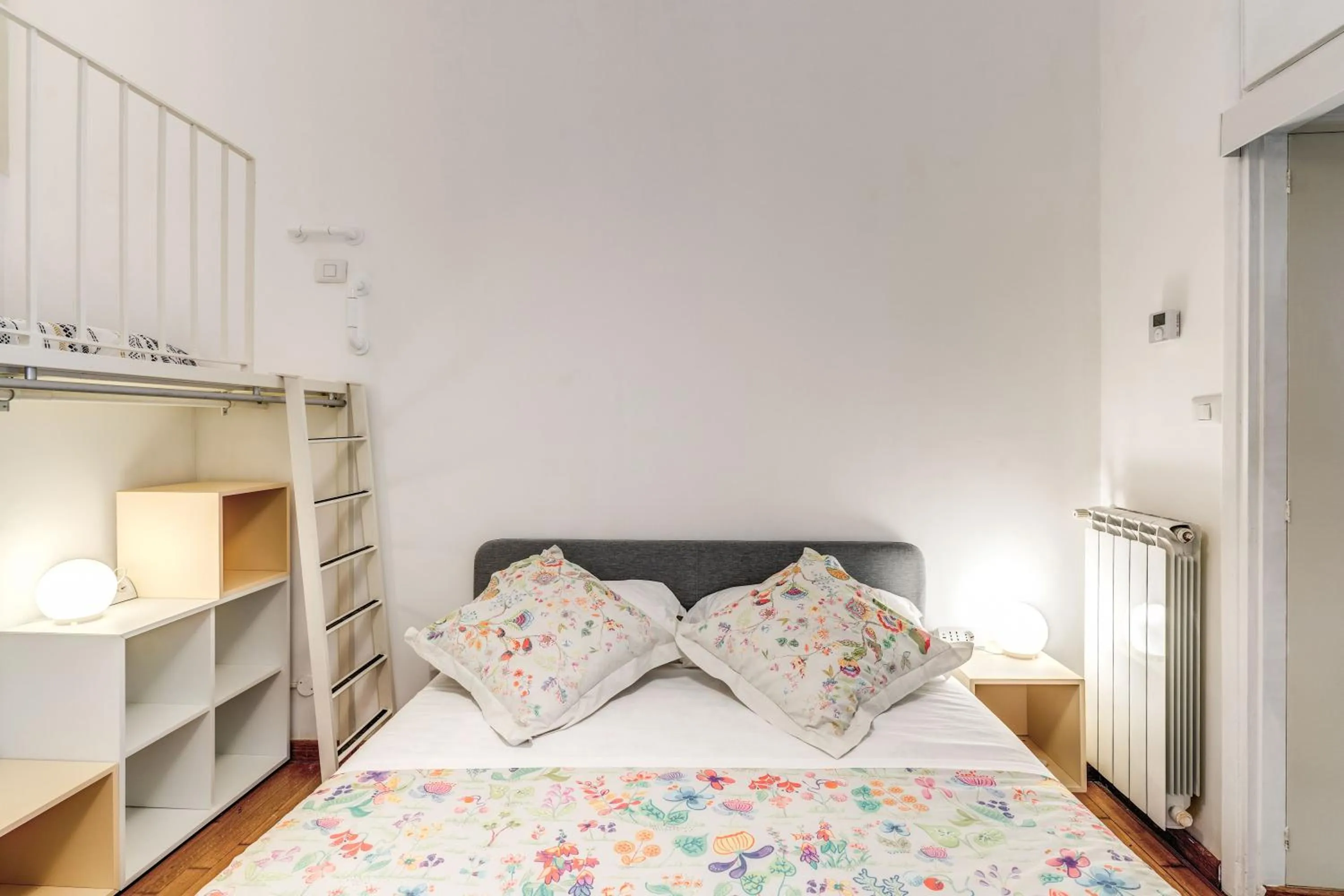 Photo of the whole room, Bed in Elegant Apartment Behind the Colosseum