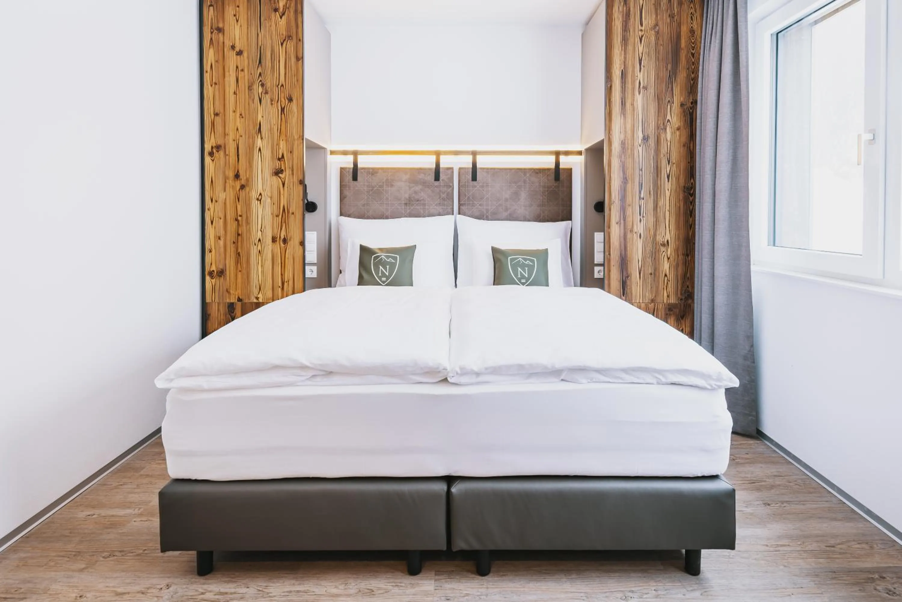 Bed in Nikolaus by AvenidA Panoramic Wellness Suites