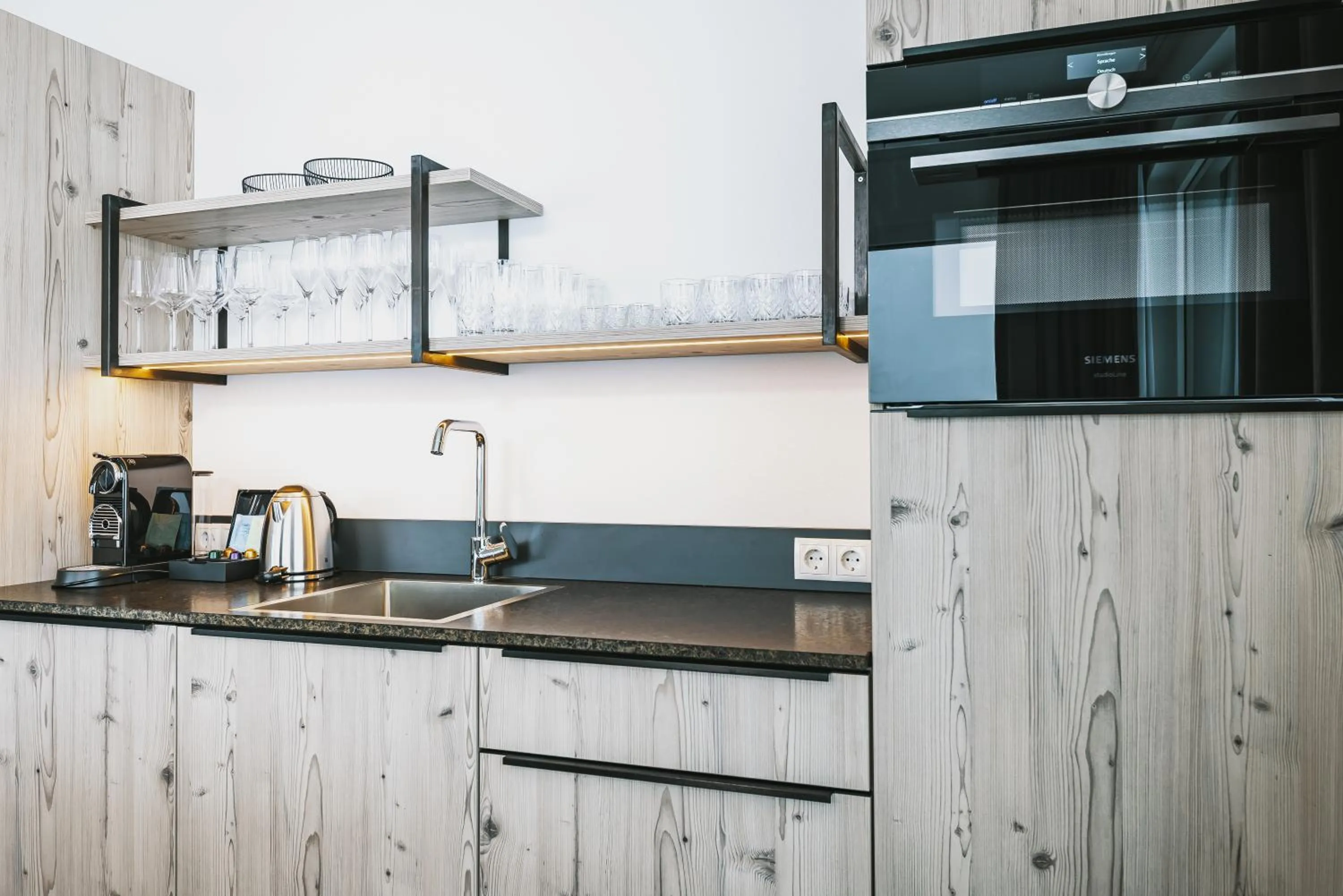 Kitchen or kitchenette in Nikolaus by AvenidA Panoramic Wellness Suites