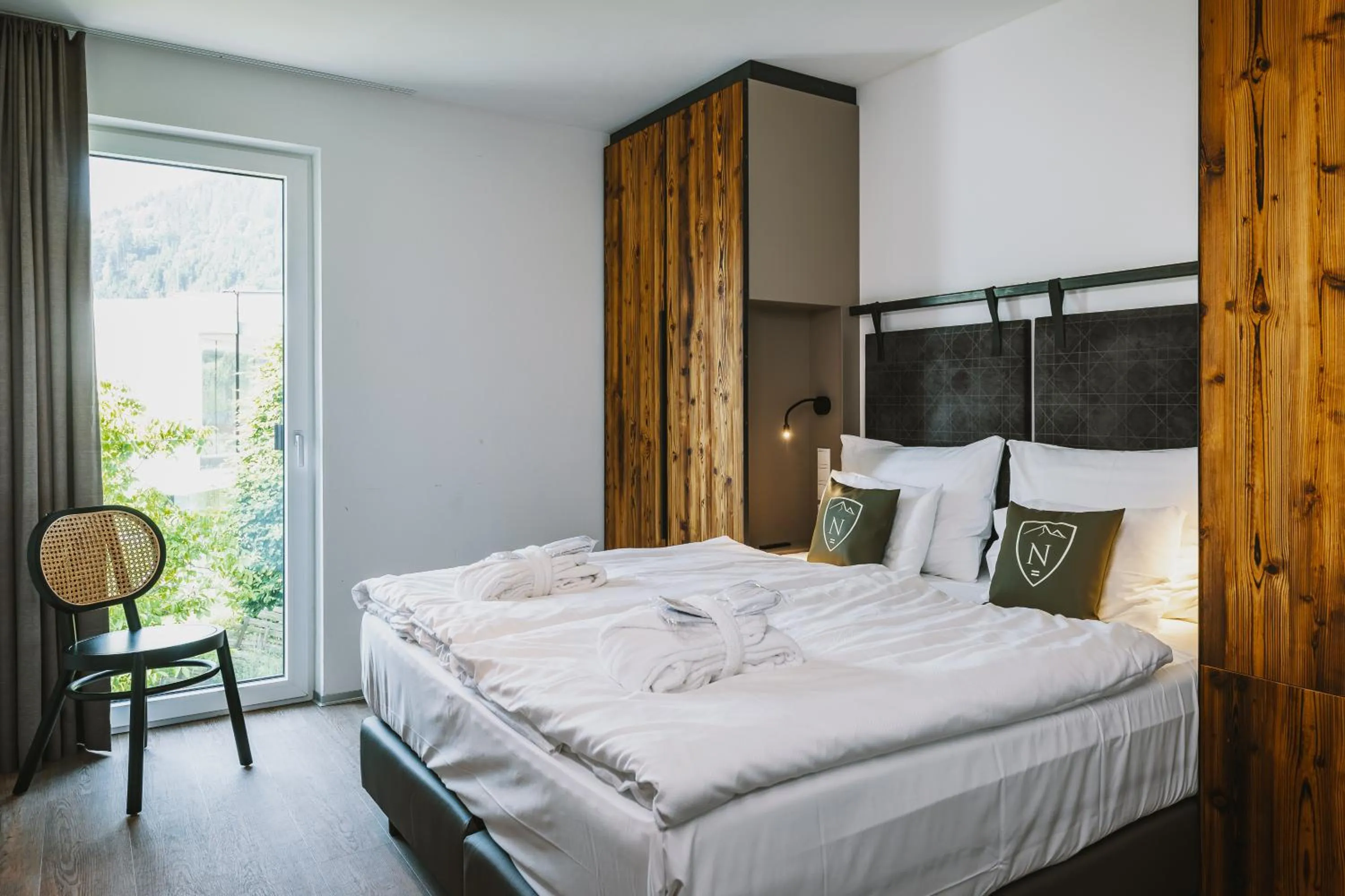 Bed in Nikolaus by AvenidA Panoramic Wellness Suites