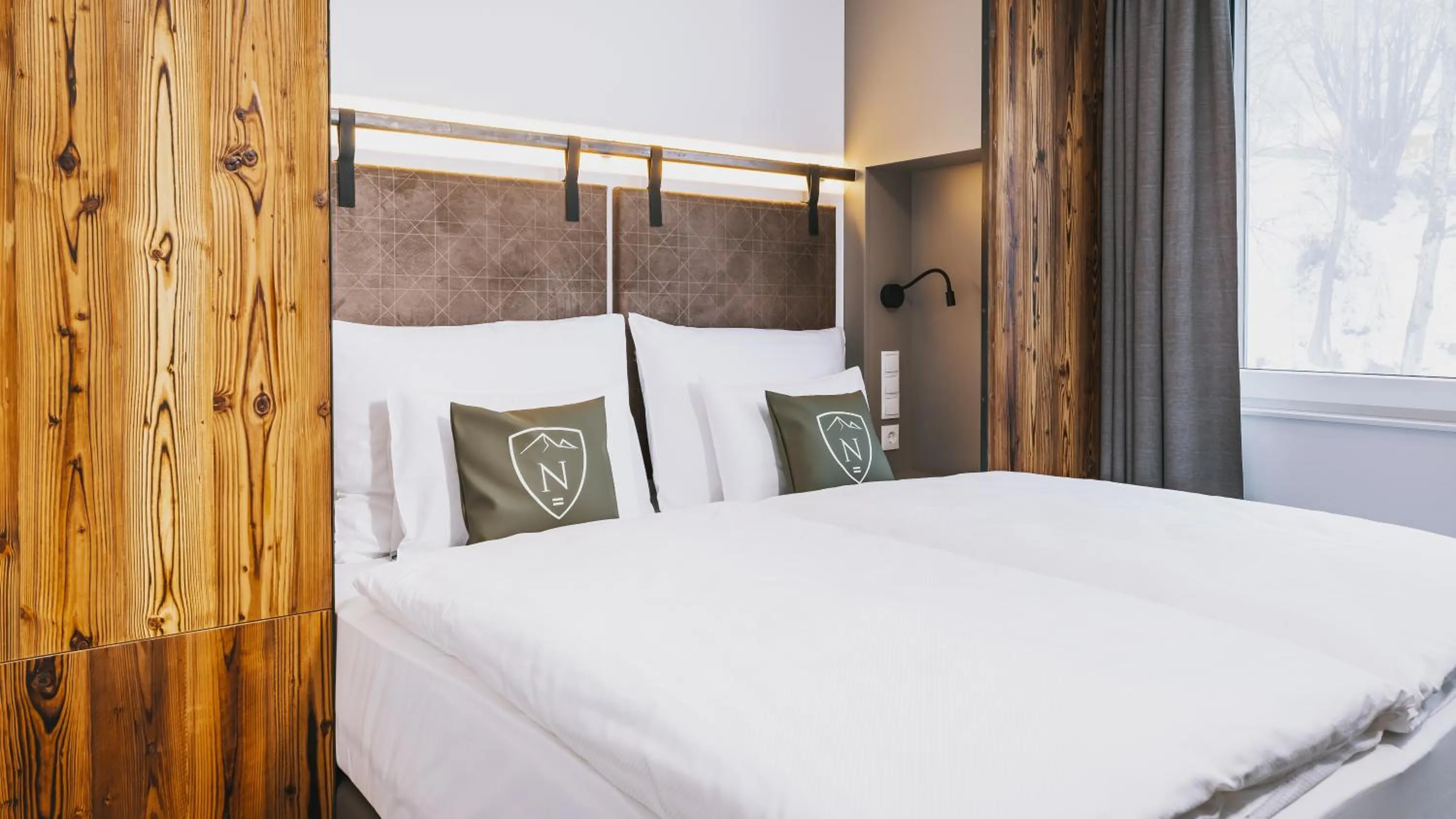 Bed in Nikolaus by AvenidA Panoramic Wellness Suites