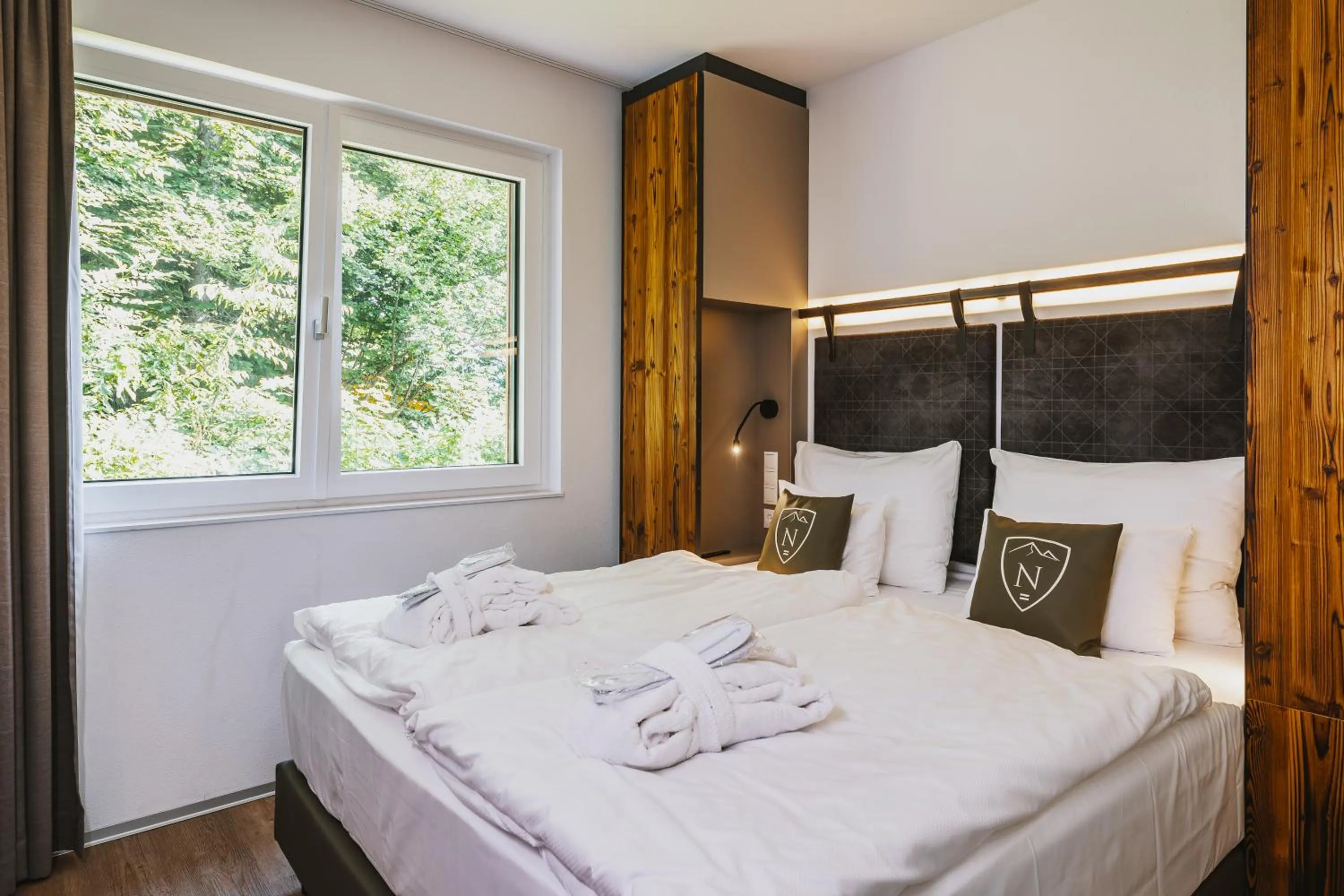 Bed in Nikolaus by AvenidA Panoramic Wellness Suites