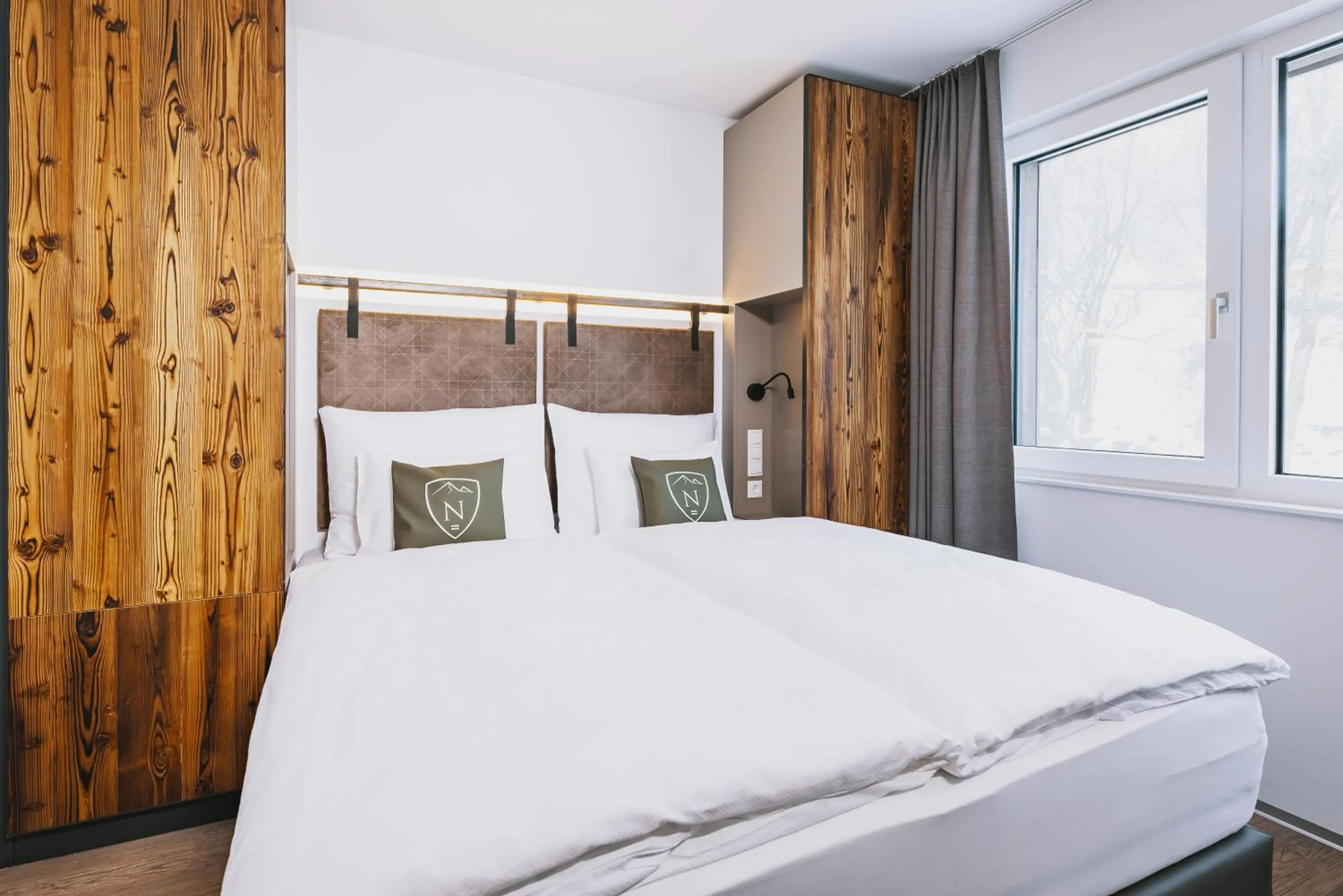 Bed in Nikolaus by AvenidA Panoramic Wellness Suites