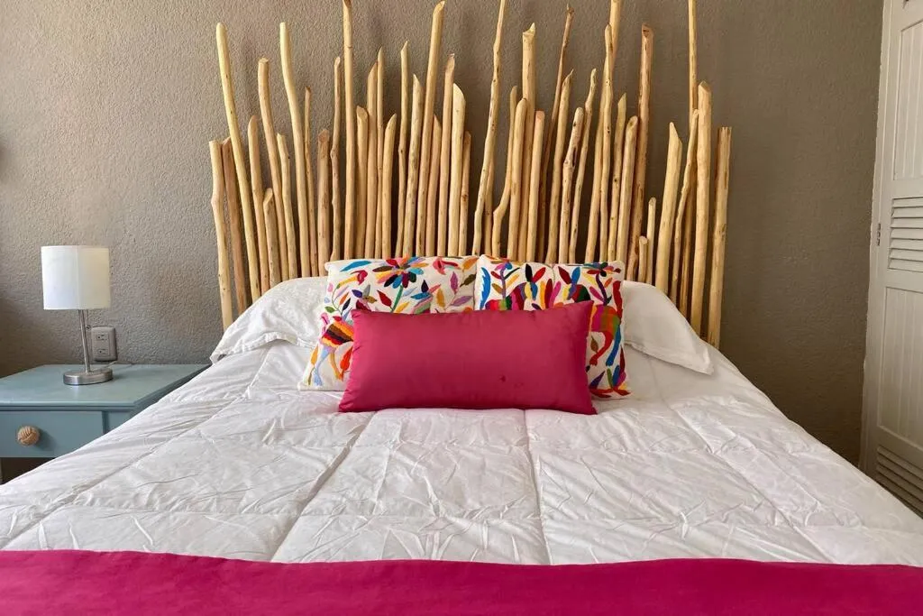 Bed in Oceanfront Condo BM By Andiani