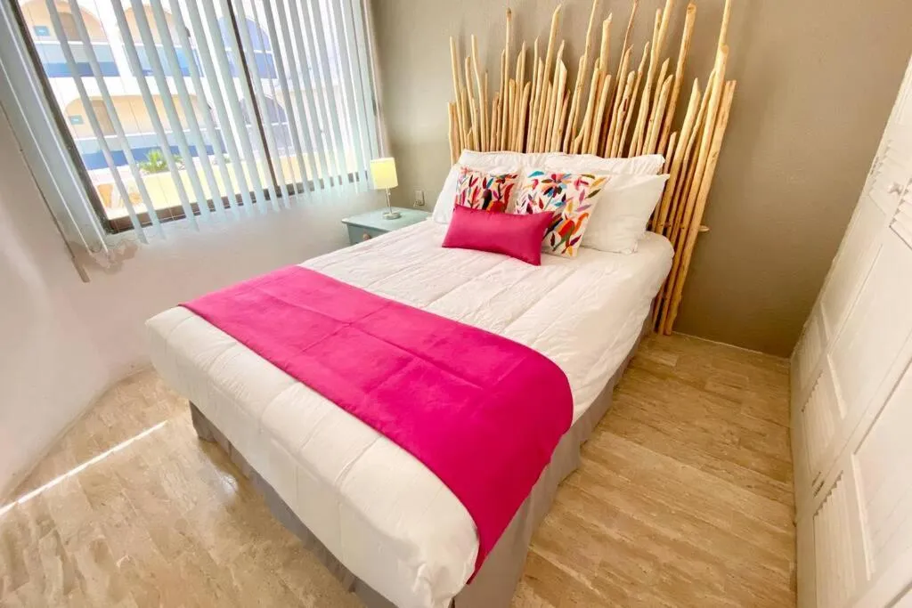 Bed in Oceanfront Condo BM By Andiani