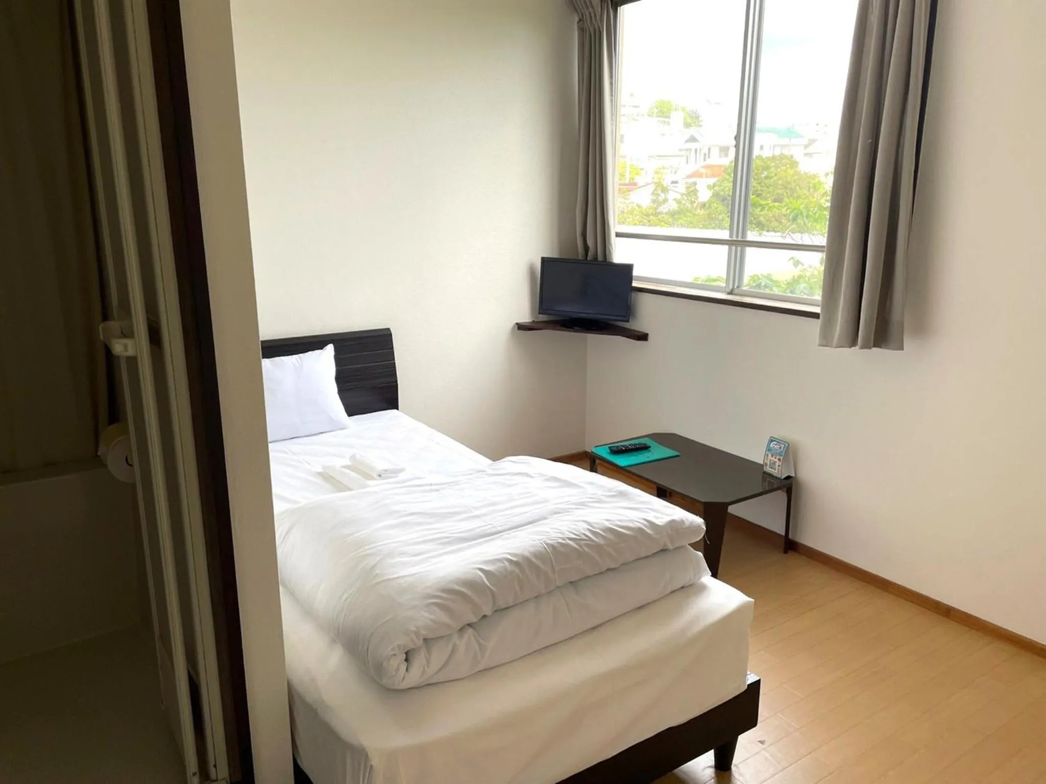 Photo of the whole room, Bed in Southern Village Okinawa