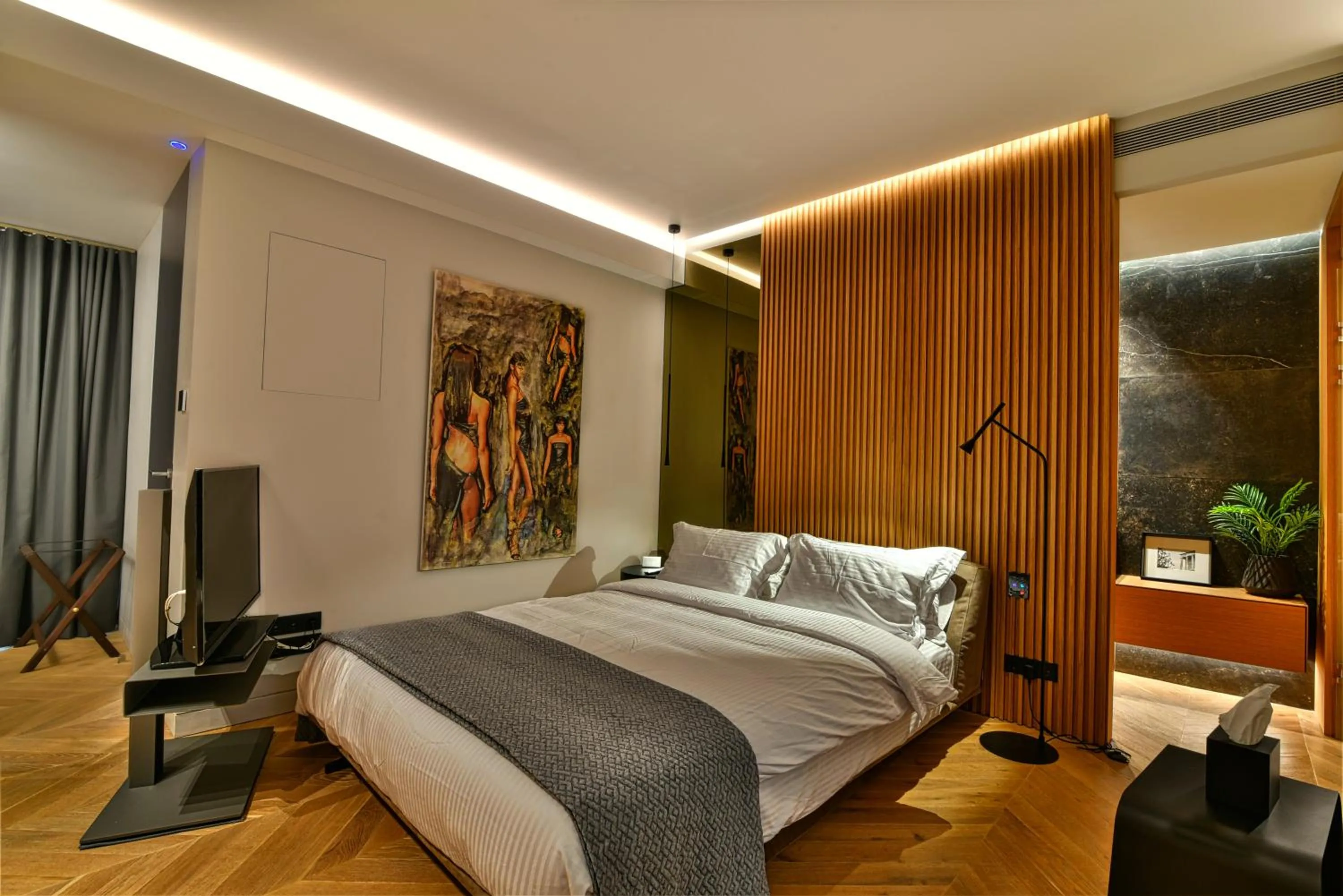 Bed in Nikiou Suites Luxury Residence