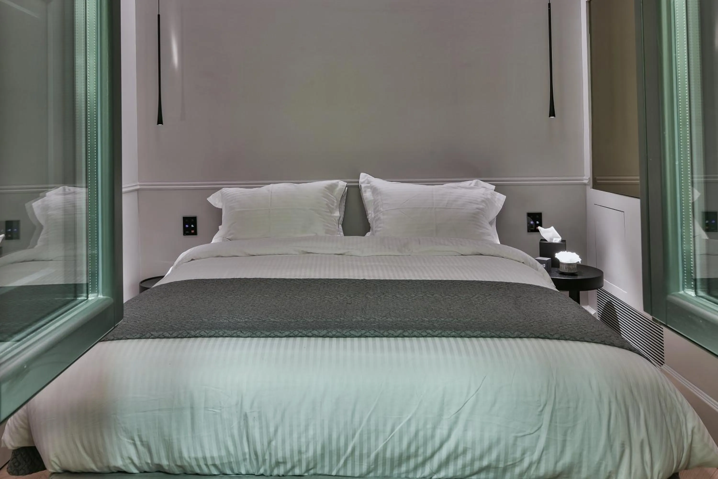 Bed in Nikiou Suites Luxury Residence