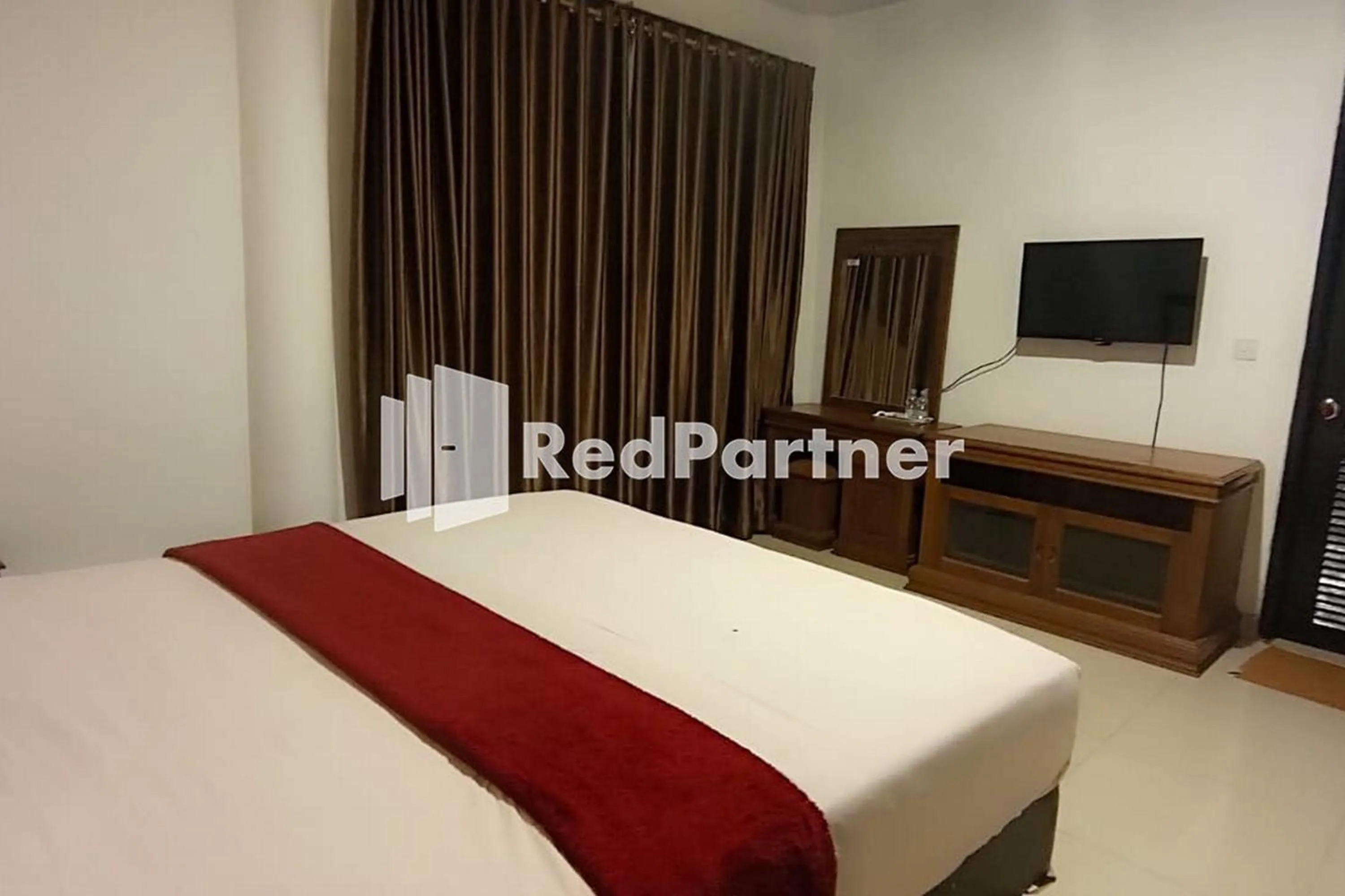 Bed in Hotel Abna Sangatta Mitra RedDoorz