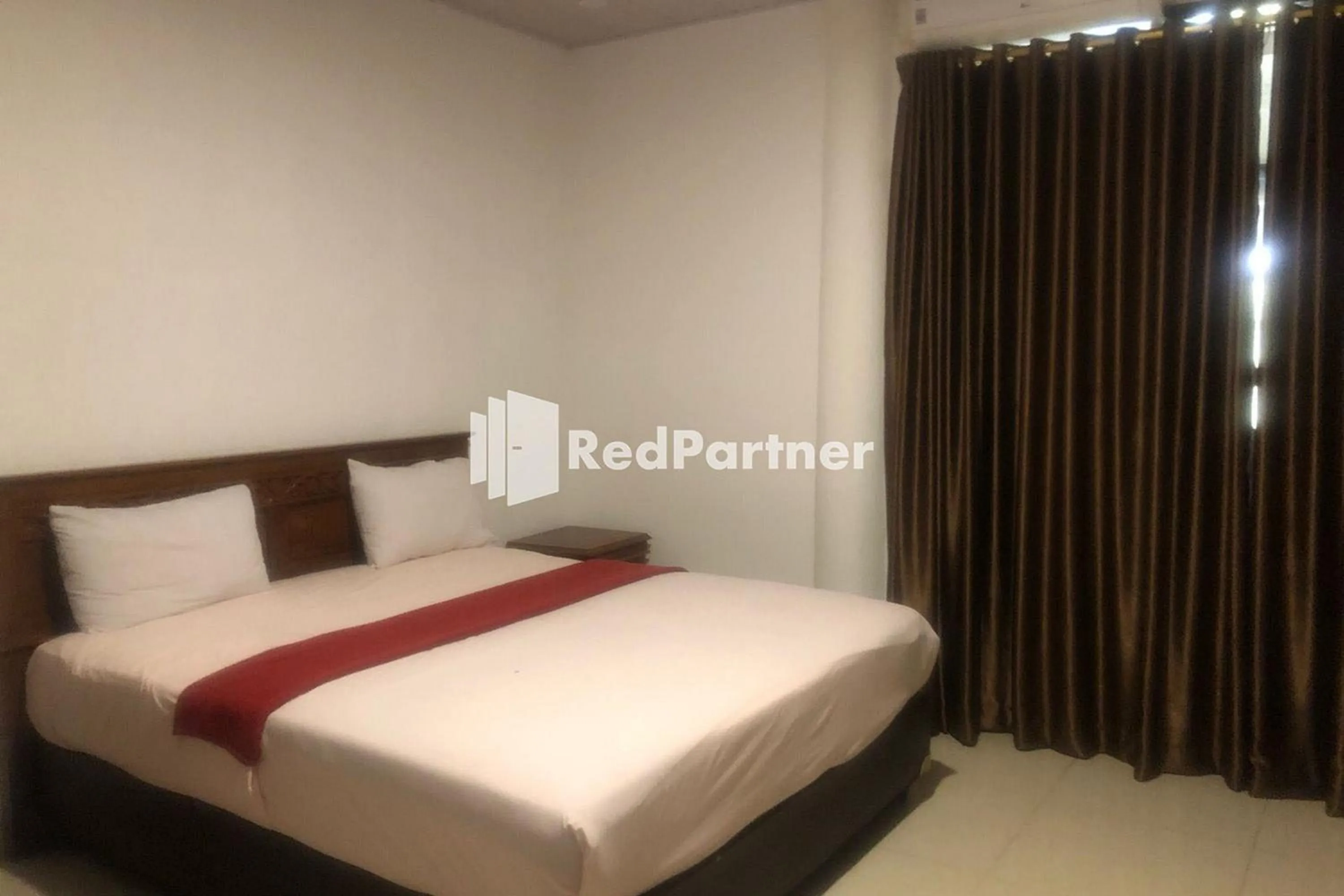 Bed in Hotel Abna Sangatta Mitra RedDoorz