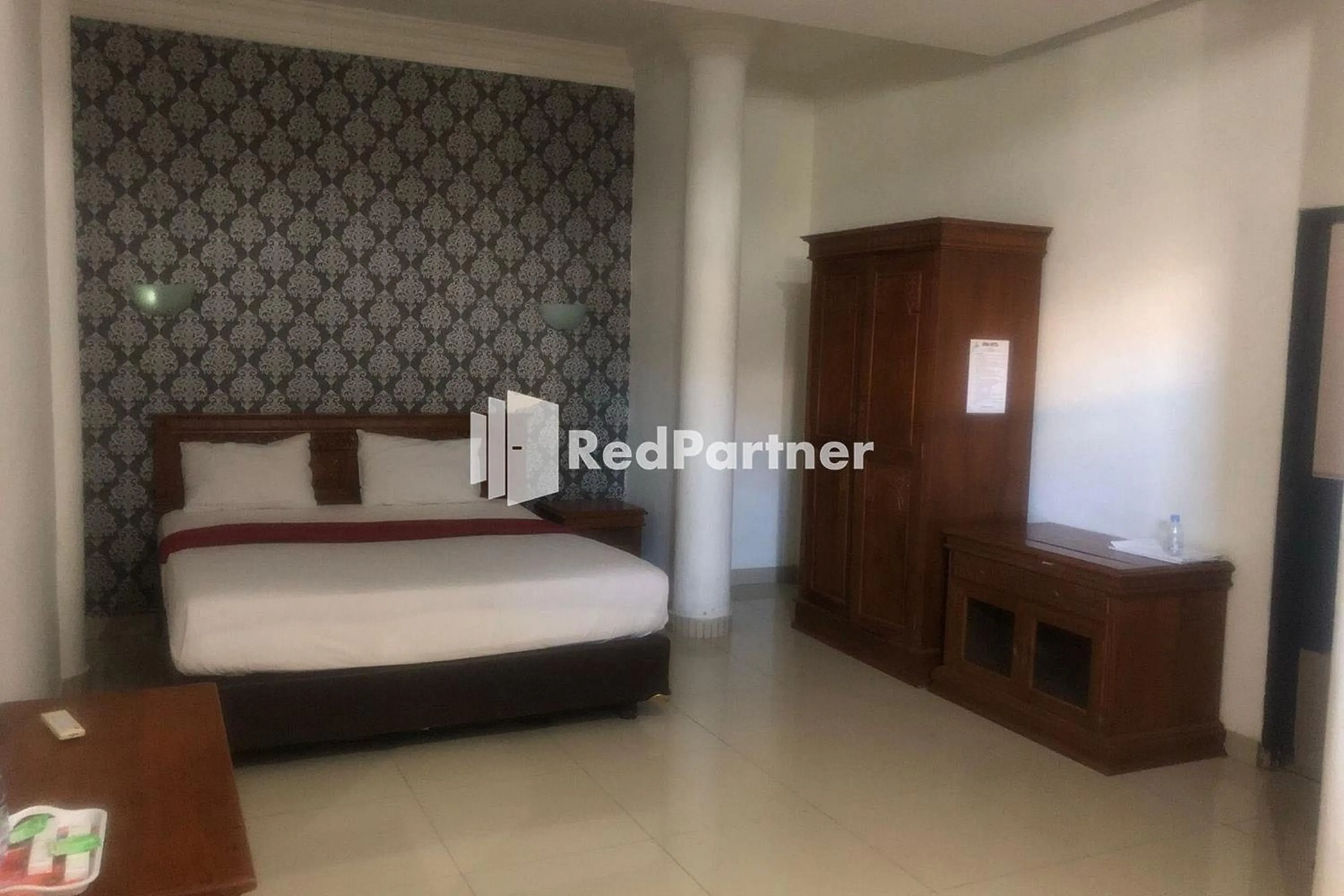 Bed in Hotel Abna Sangatta Mitra RedDoorz