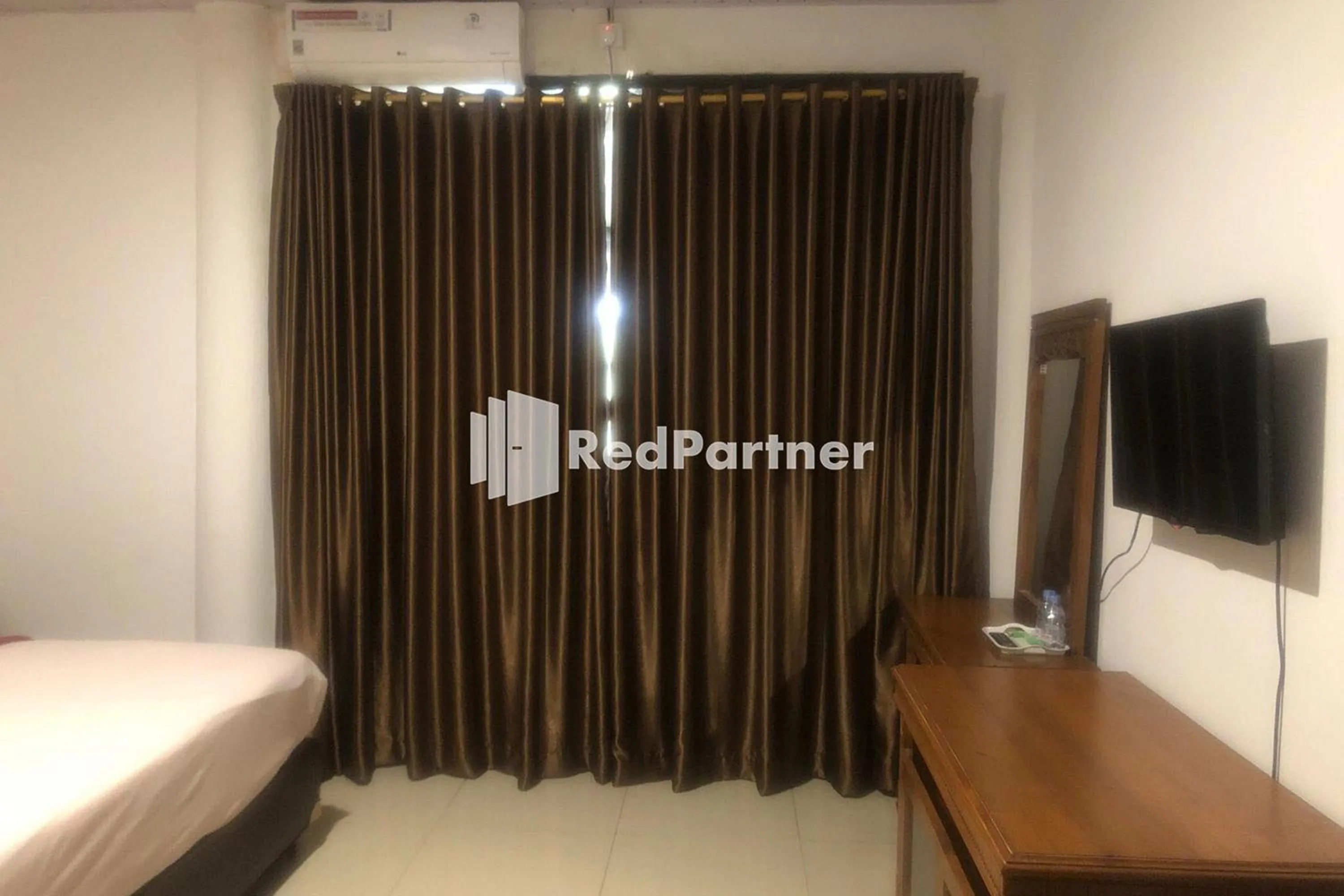 Bed in Hotel Abna Sangatta Mitra RedDoorz