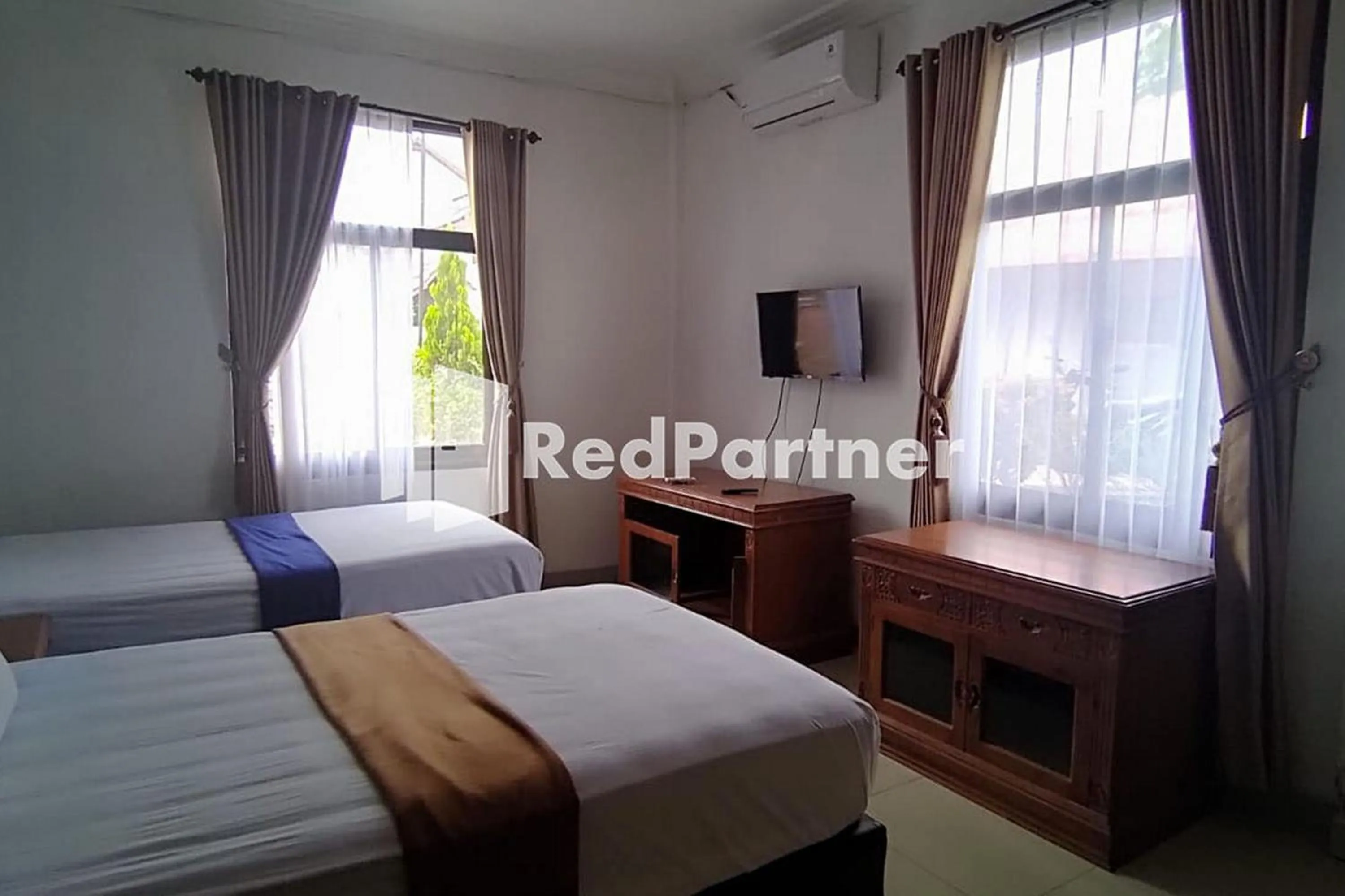 Bed in Hotel Abna Sangatta Mitra RedDoorz