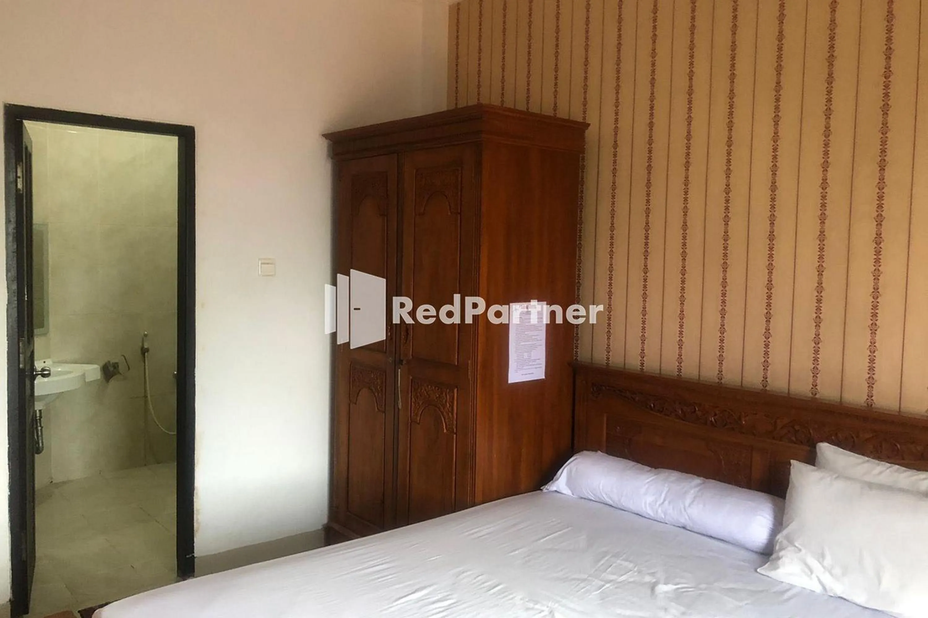 Bed in Hotel Abna Sangatta Mitra RedDoorz