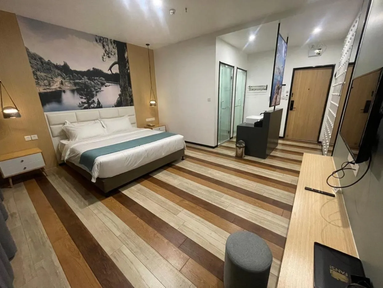 Bed in Fan's Hotel Baybay