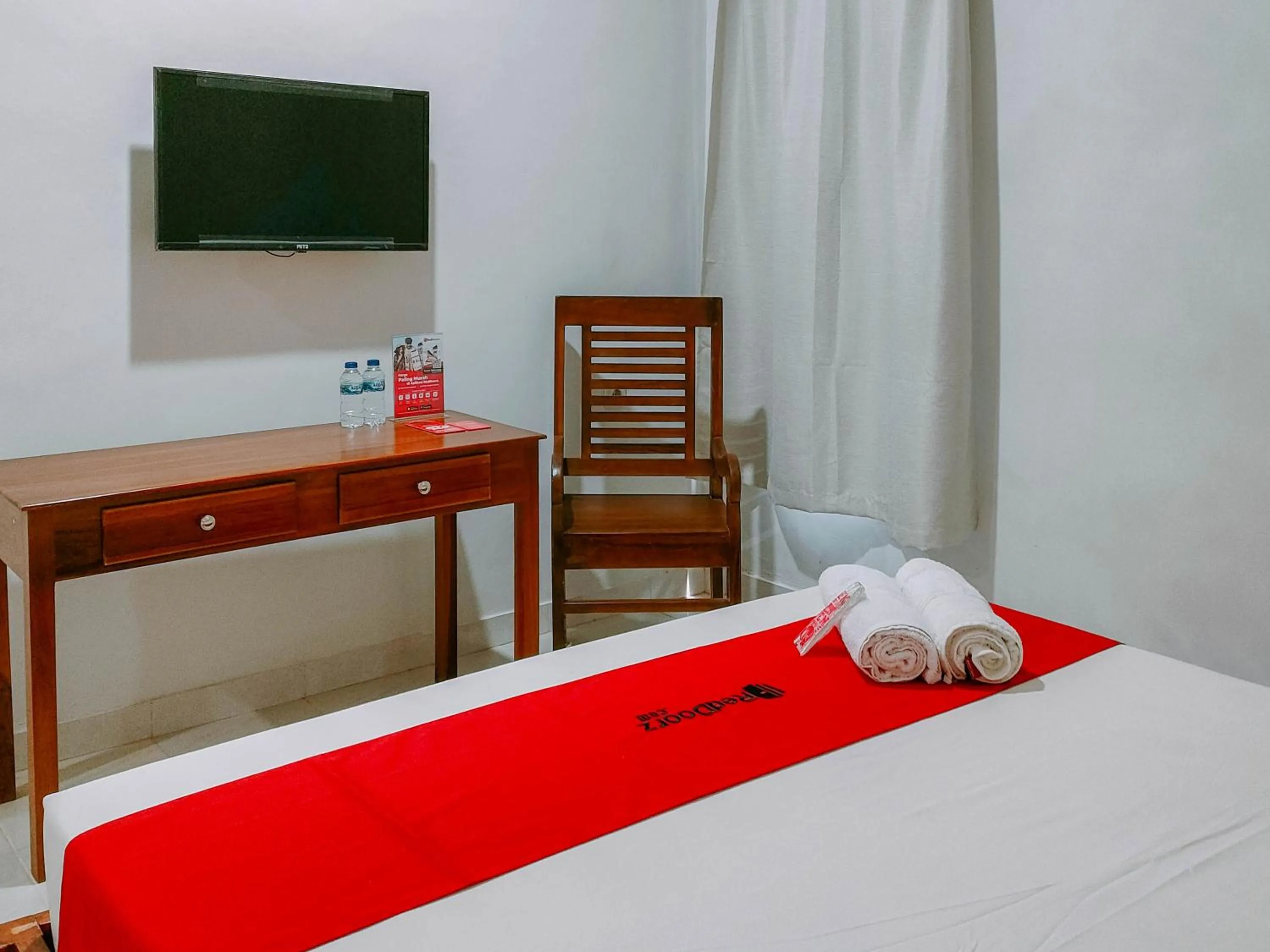 Bed in RedDoorz at Omah Candi Sari near Airport YIA