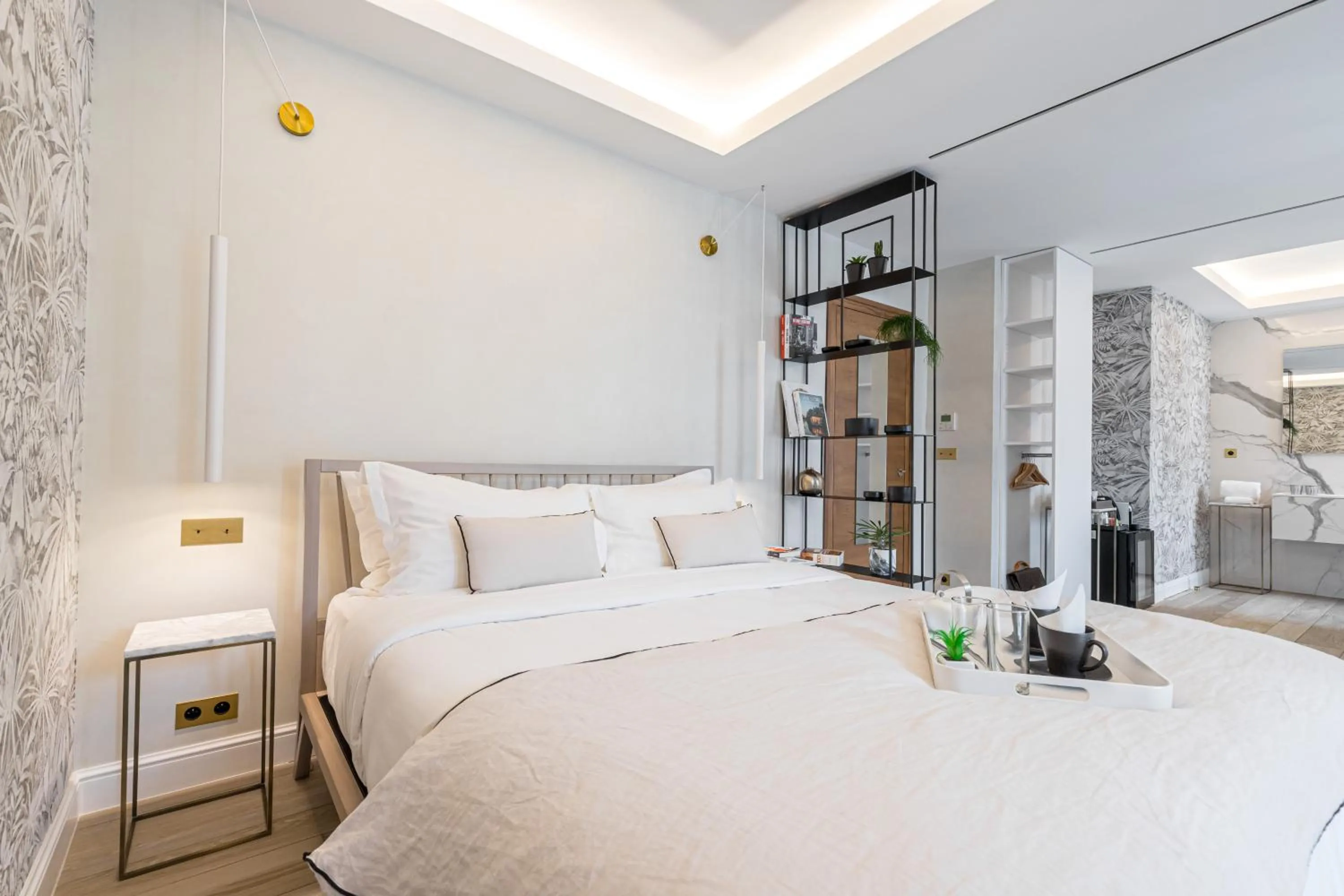 Bed in Le Dortoir Boutique Suites