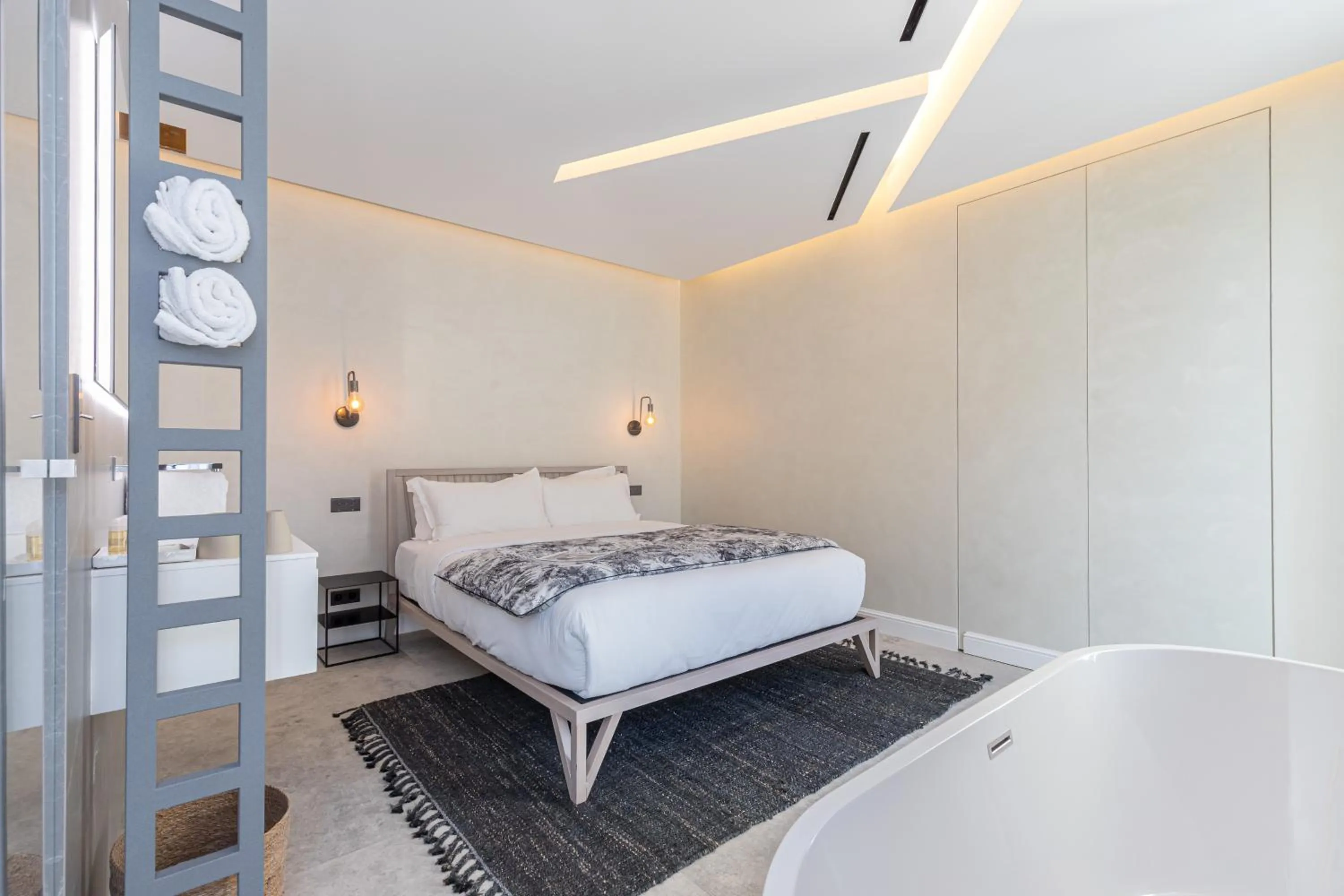 Bed in Le Dortoir Boutique Suites