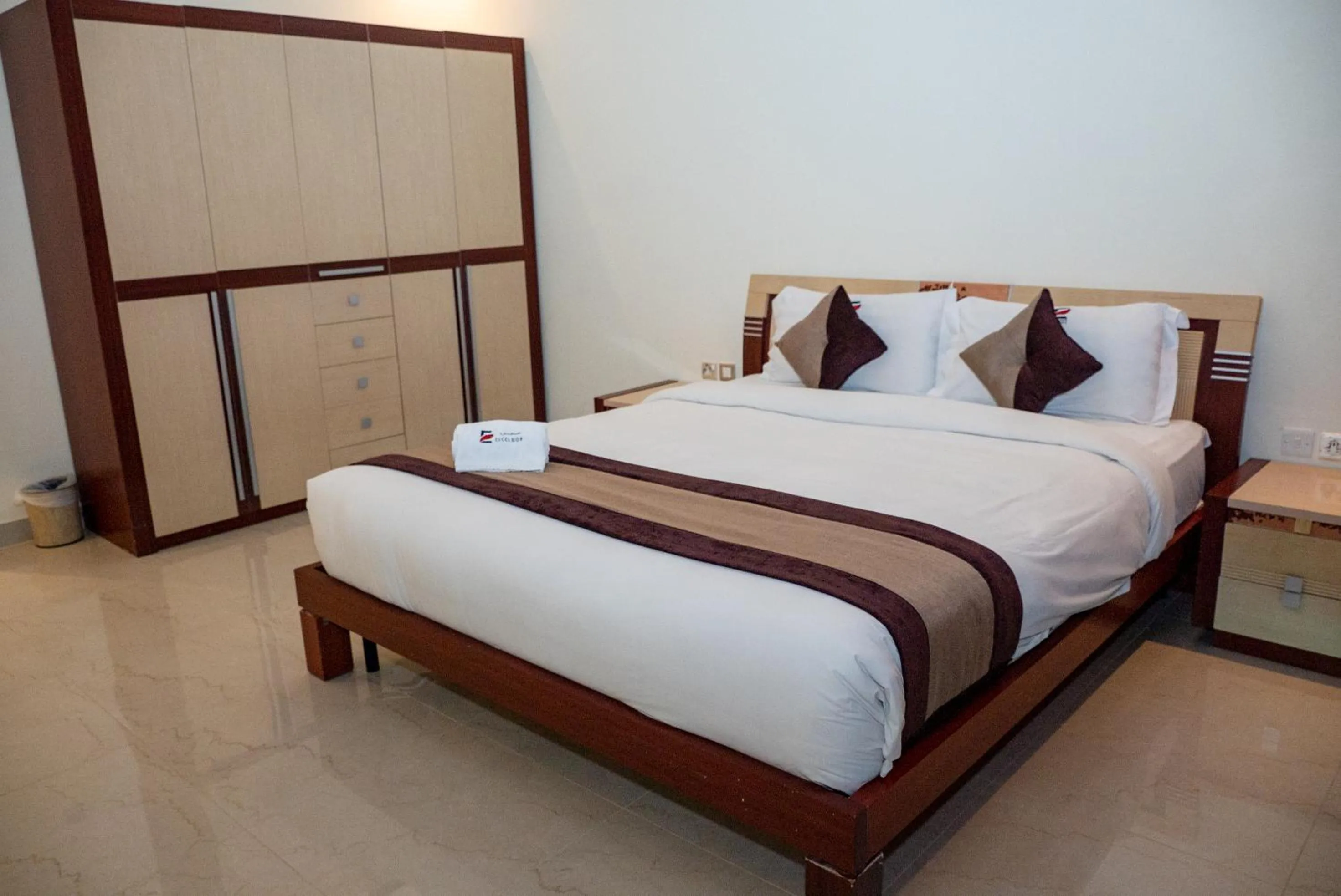 Bed in Excelsior Luxury Apartments