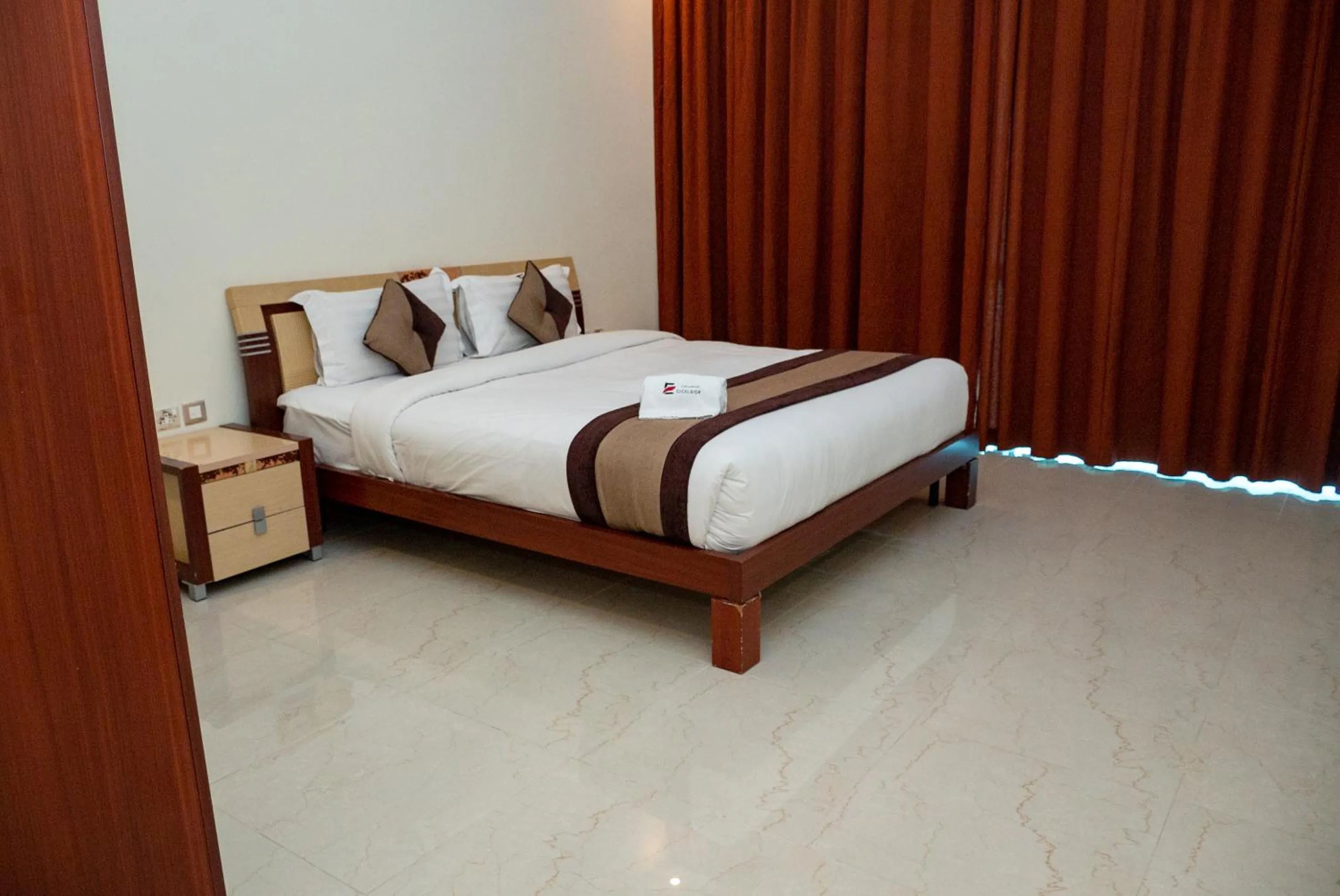 Bed in Excelsior Luxury Apartments