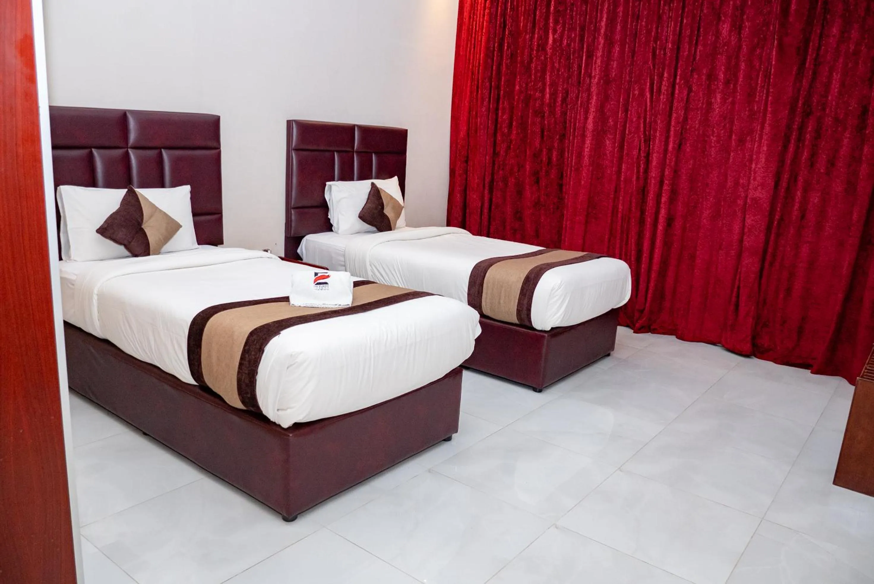 Bed in Excelsior Luxury Apartments