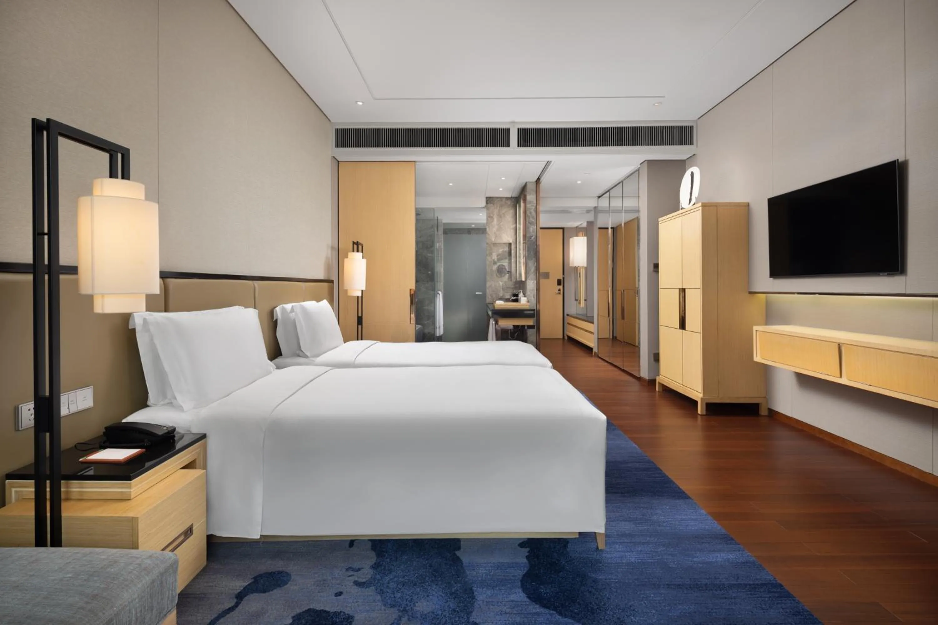 Bed in New World Beijing Hotel