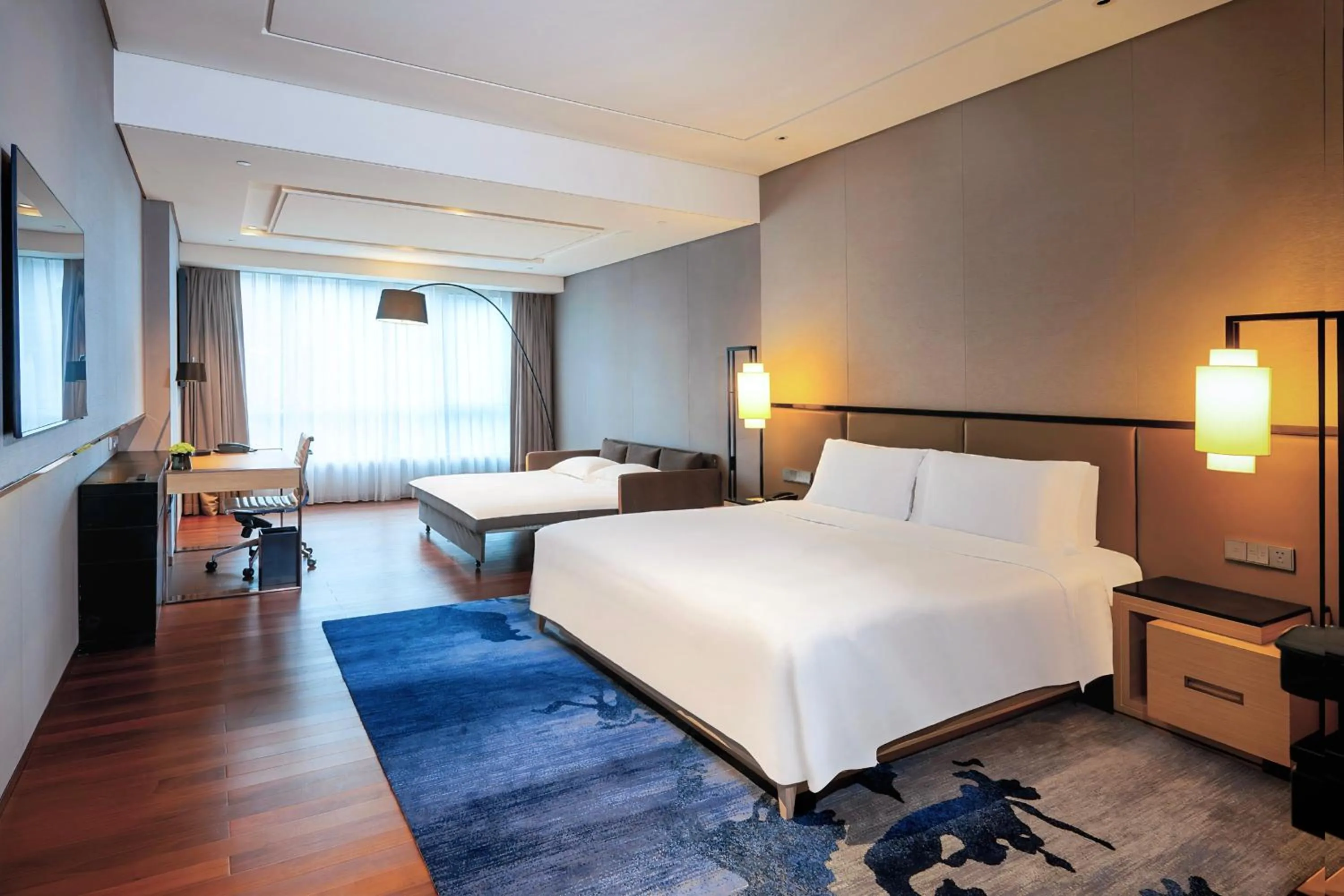 Bed in New World Beijing Hotel