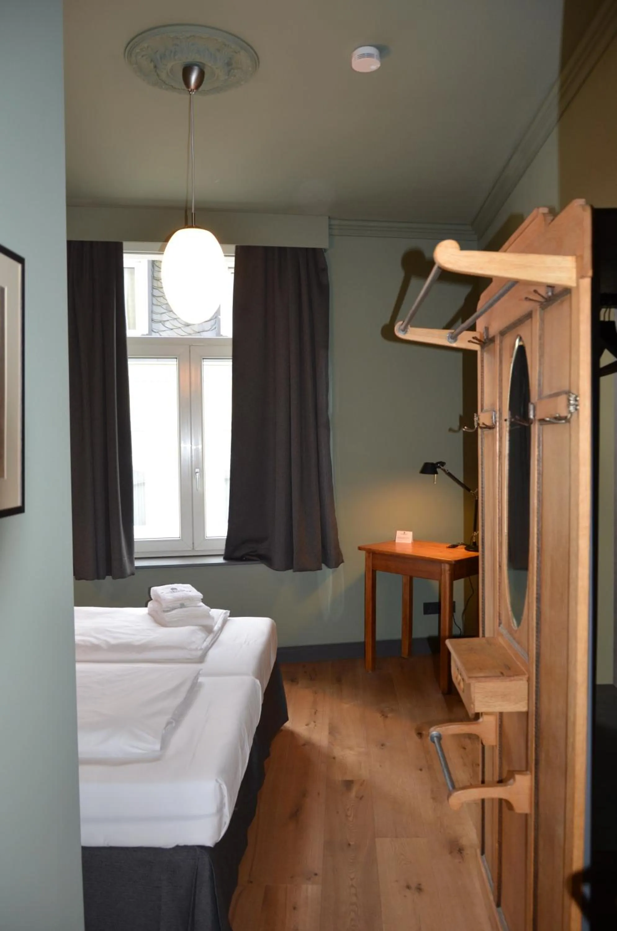 Bed in Storyhotel Bergischer Hof Königswinter