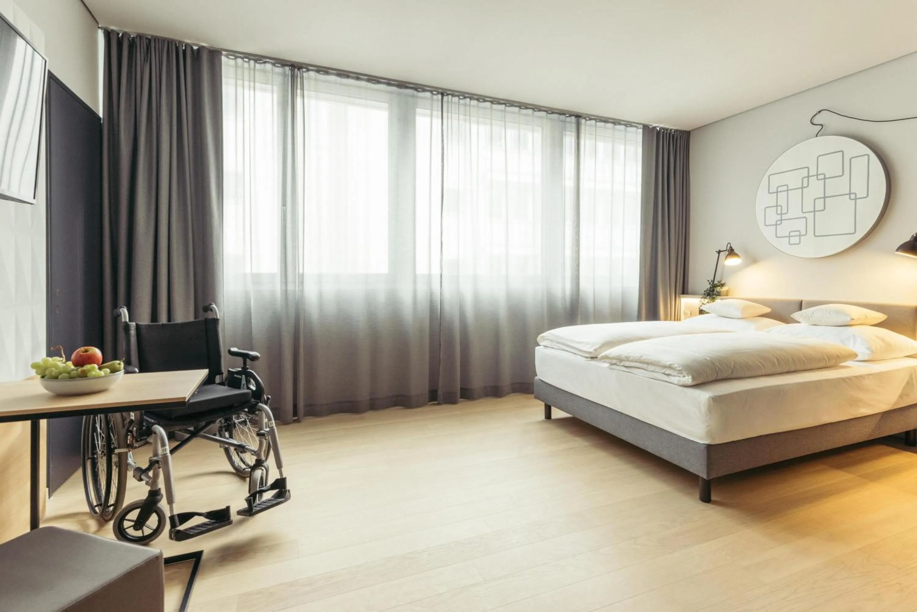 Photo of the whole room, Bed in harry's home Bern-Expo