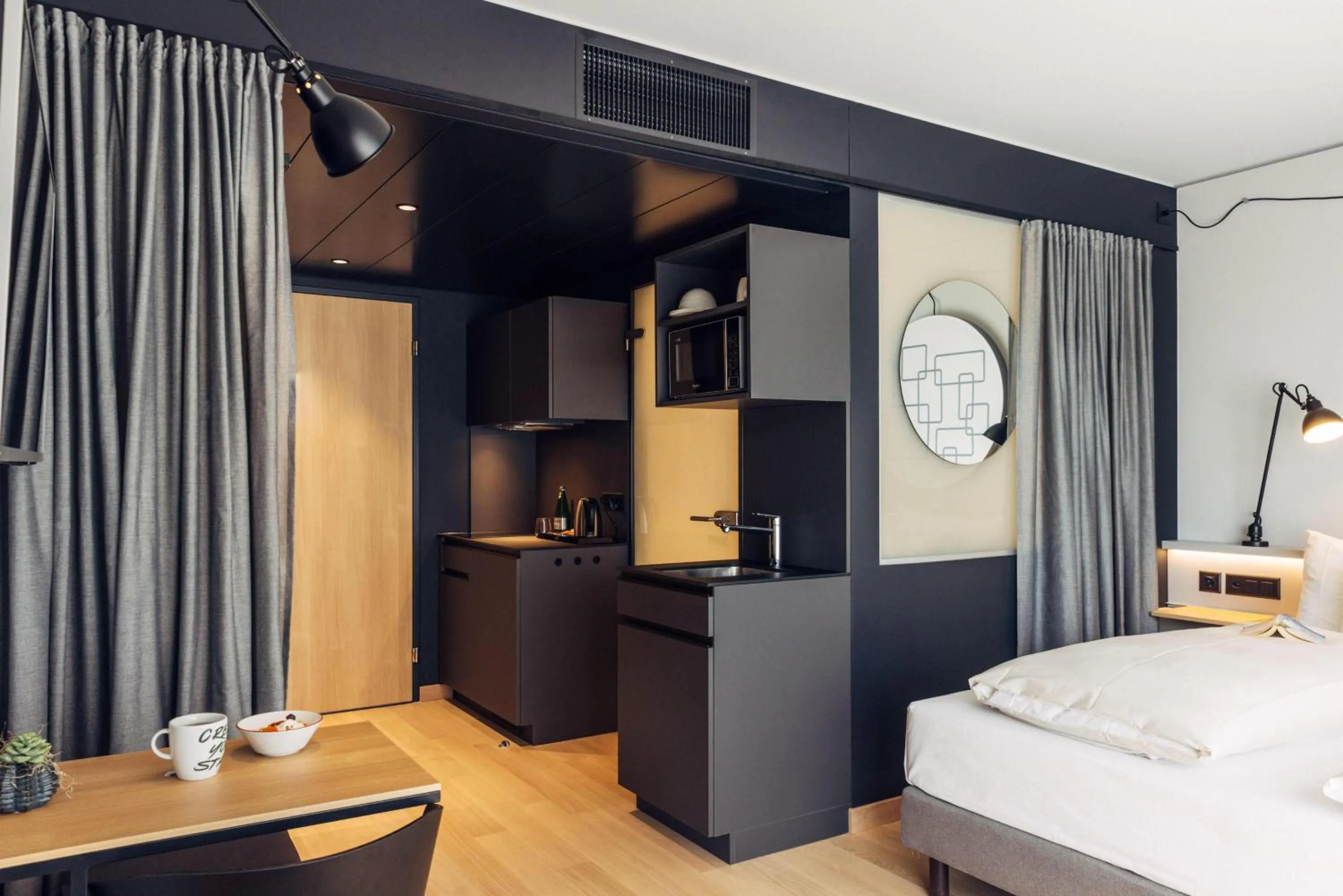 Photo of the whole room, Bed in harry's home Bern-Expo