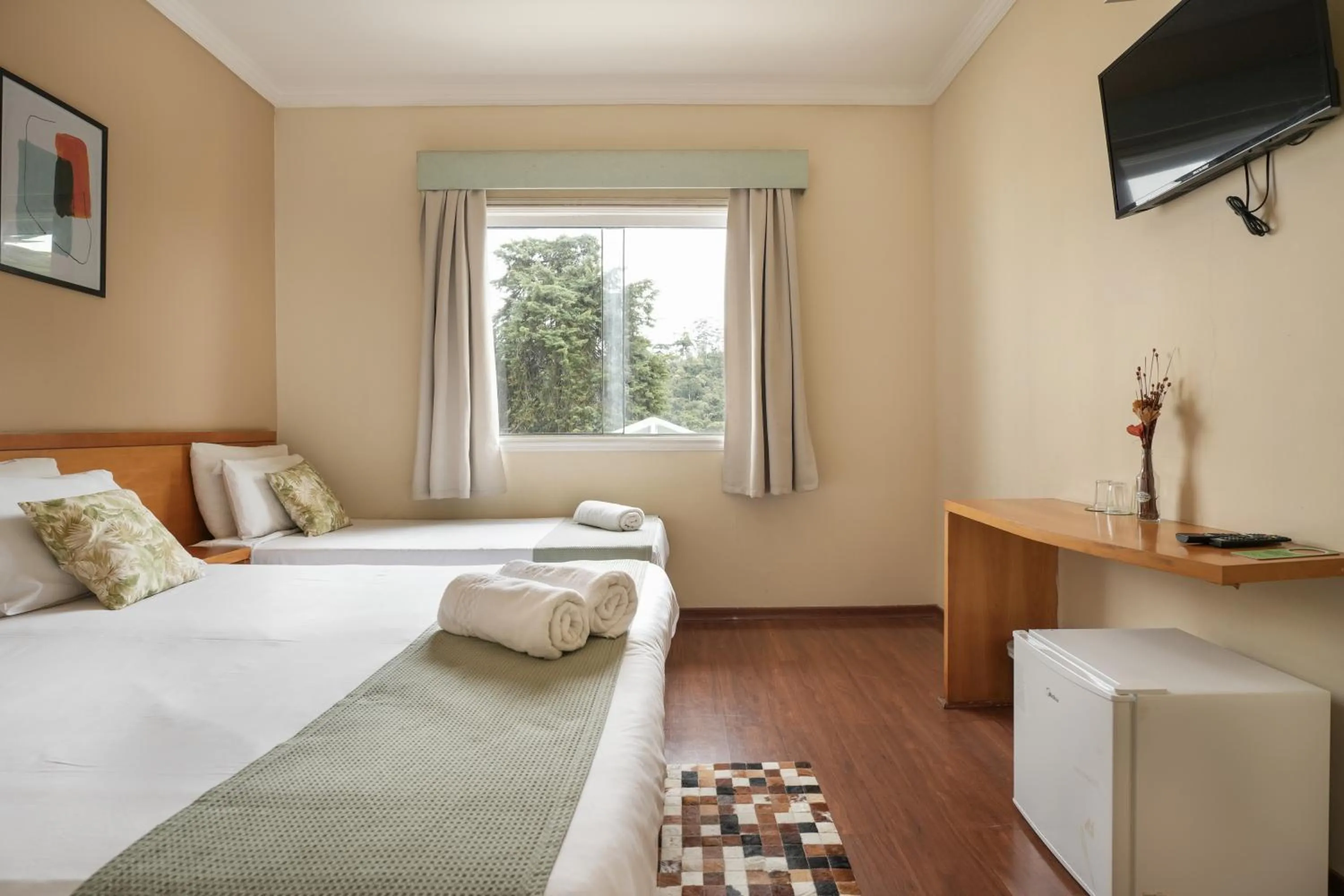 Bed in Pousada Parque das Flores