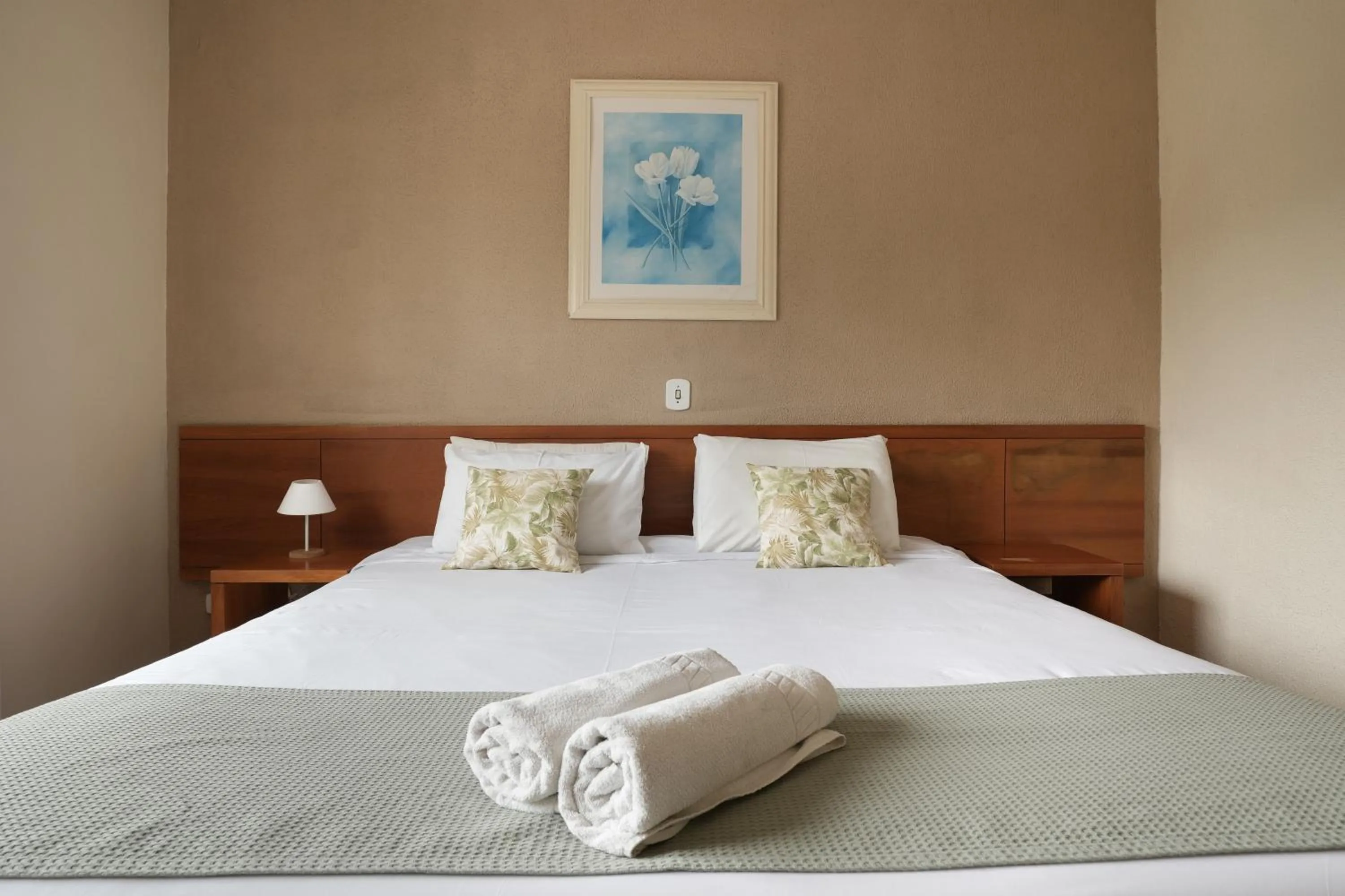 Bed in Pousada Parque das Flores