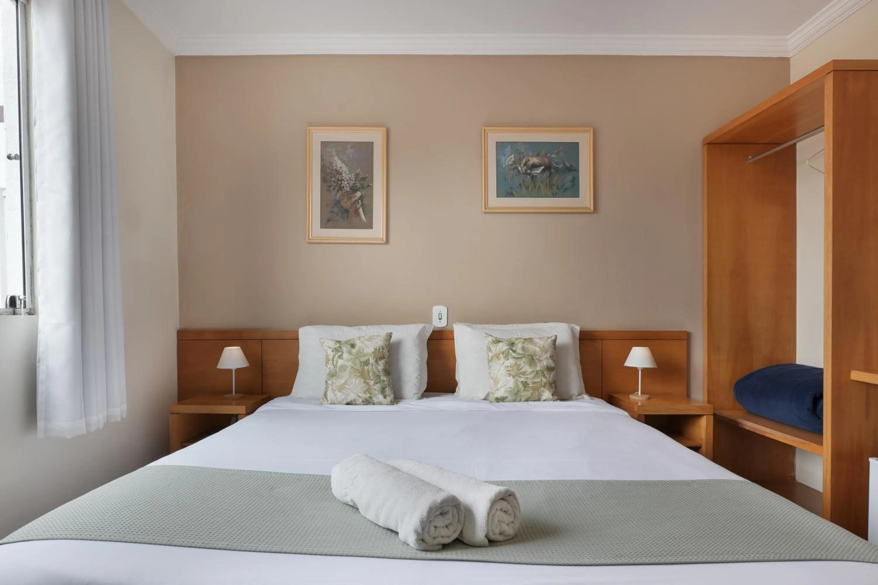 Bed in Pousada Parque das Flores