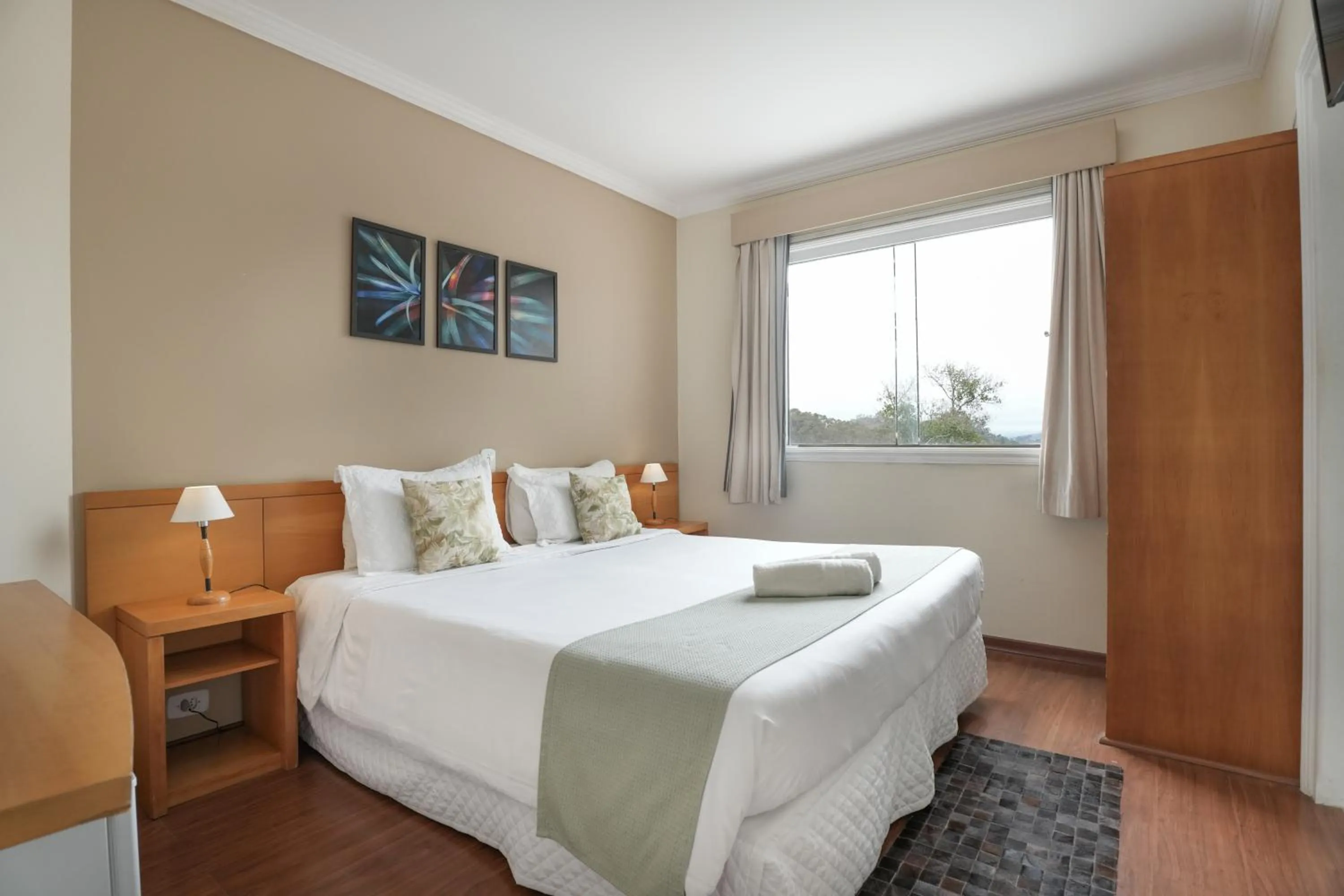 Bed in Pousada Parque das Flores