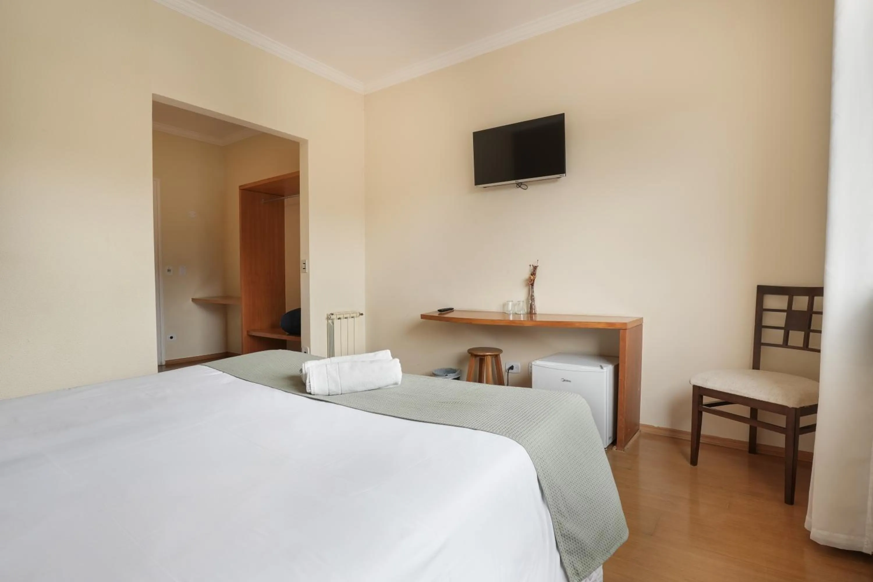 Bed in Pousada Parque das Flores