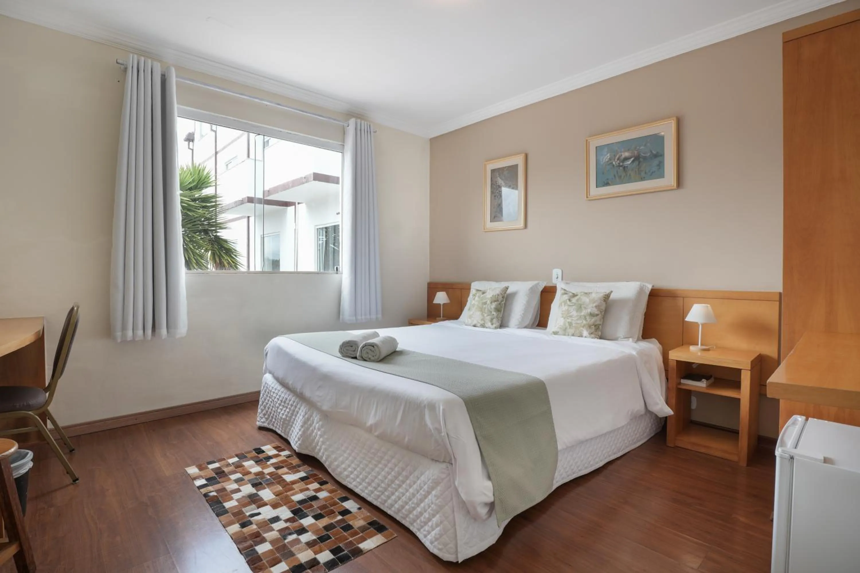 Bed in Pousada Parque das Flores