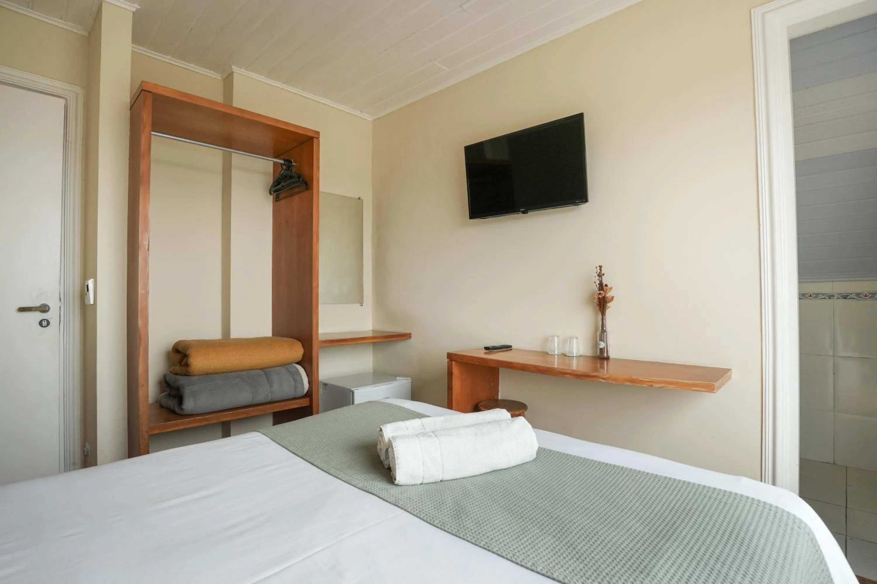 Bed in Pousada Parque das Flores