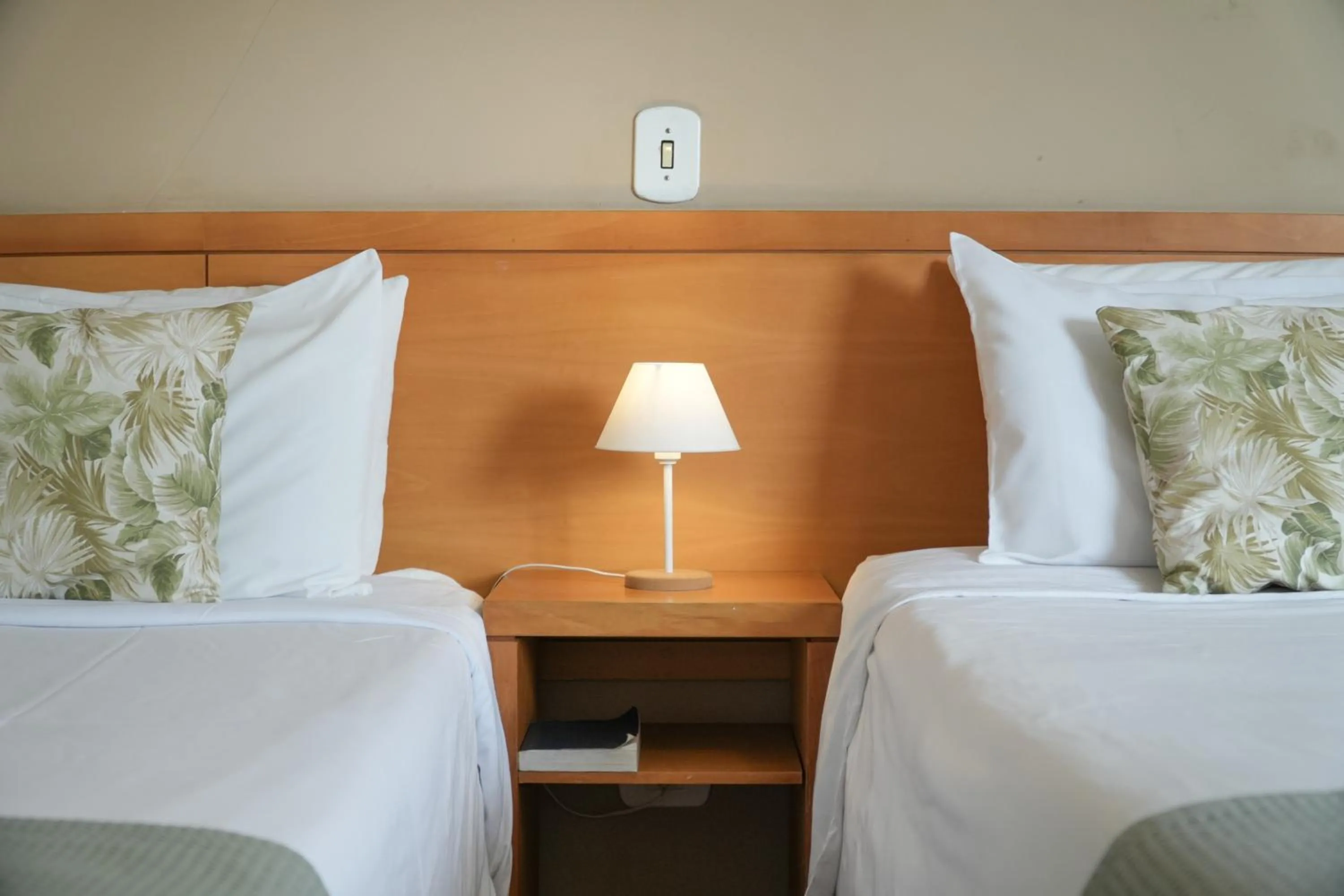 Bed in Pousada Parque das Flores