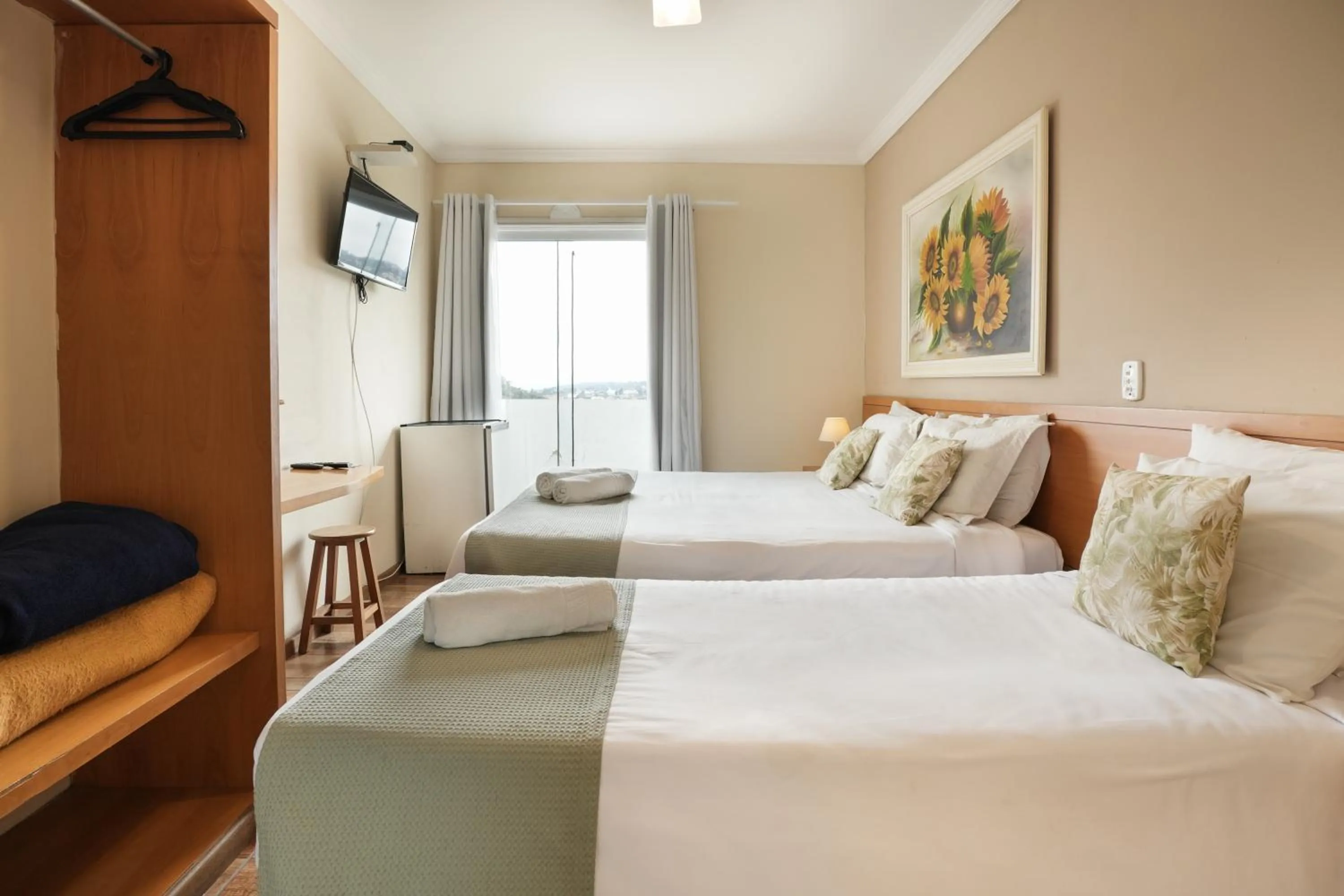 Bed in Pousada Parque das Flores