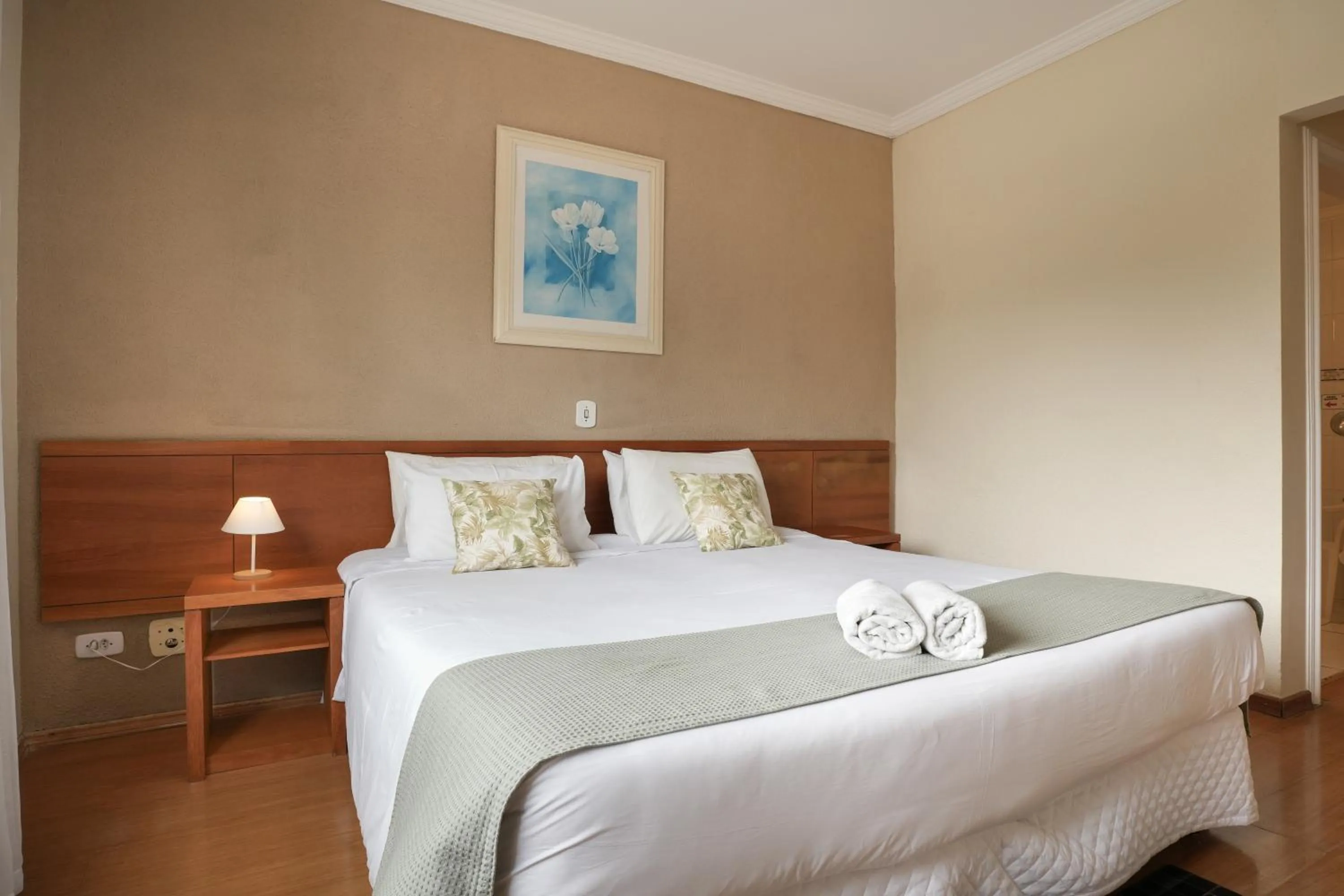 Bed in Pousada Parque das Flores