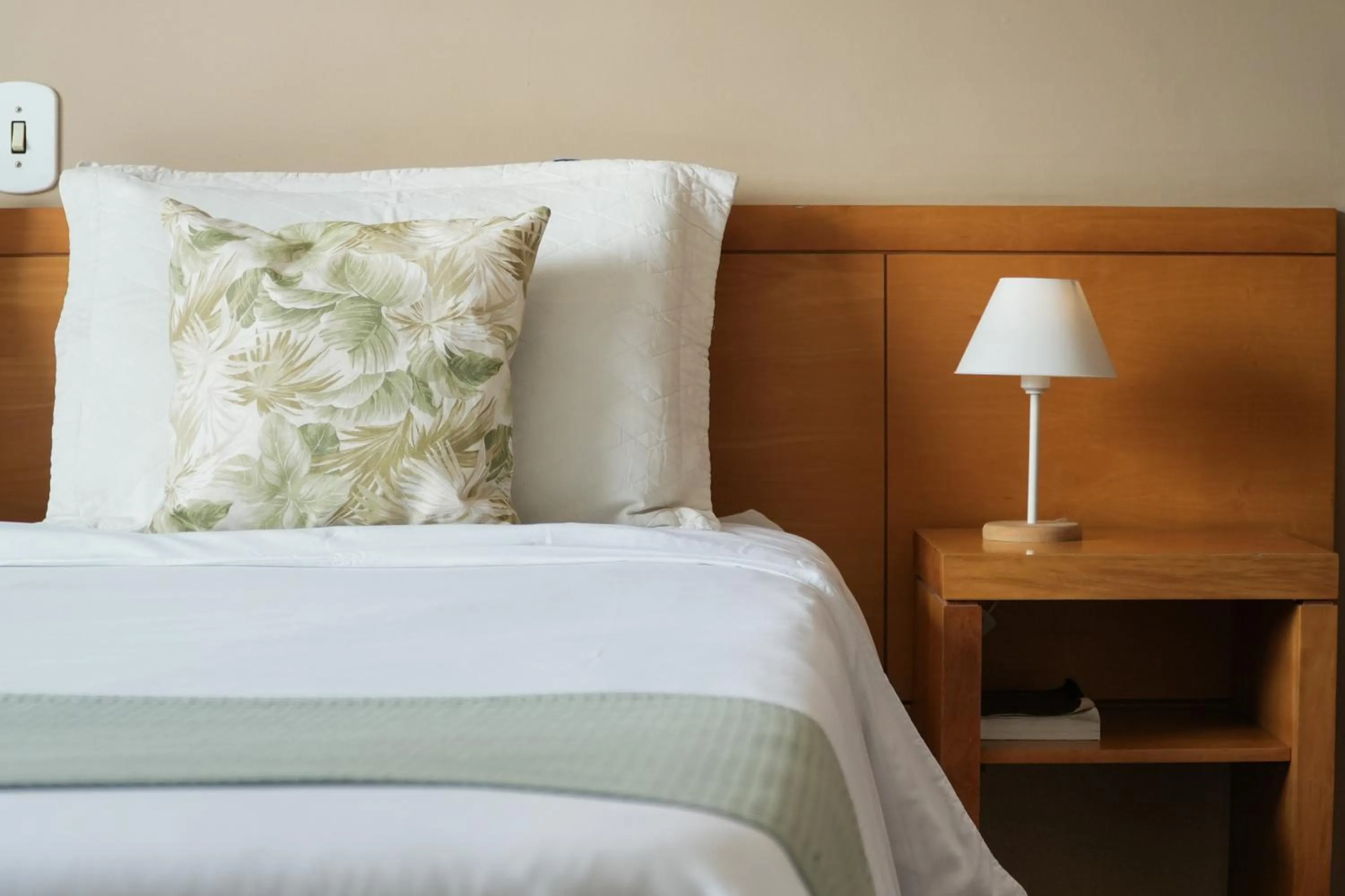 Bed in Pousada Parque das Flores