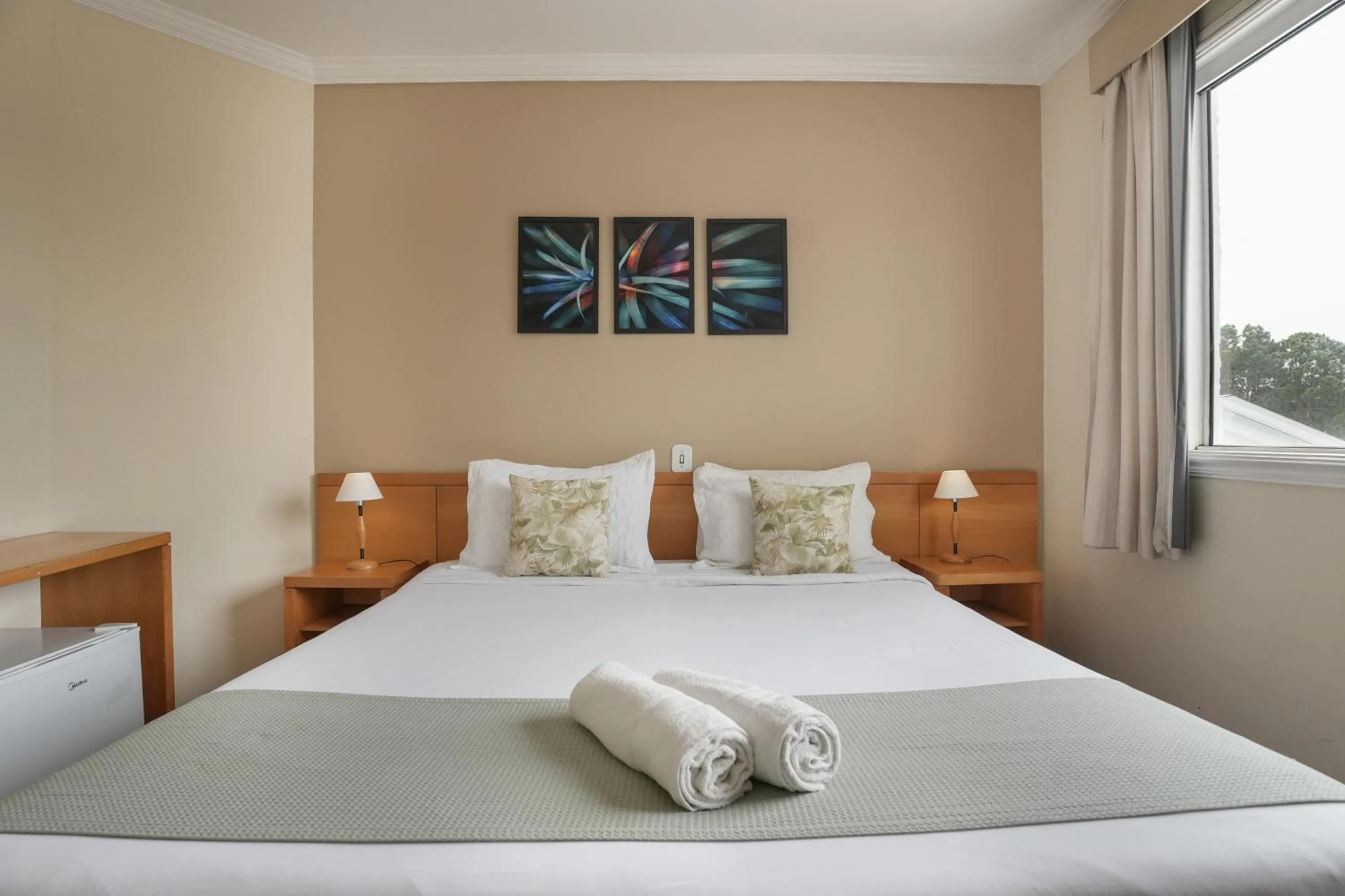 Bed in Pousada Parque das Flores