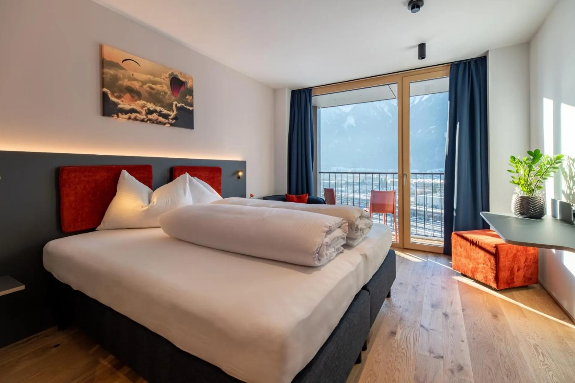 Bed in ALPSTADT LIFESTYLE Hotel
