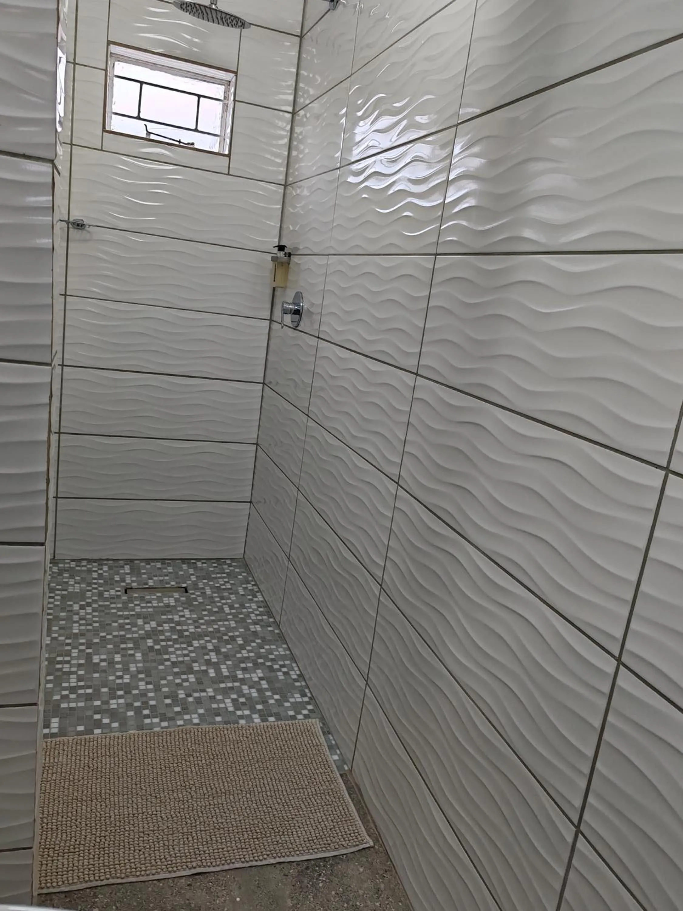 Shower in Stoep Cafe Guest House