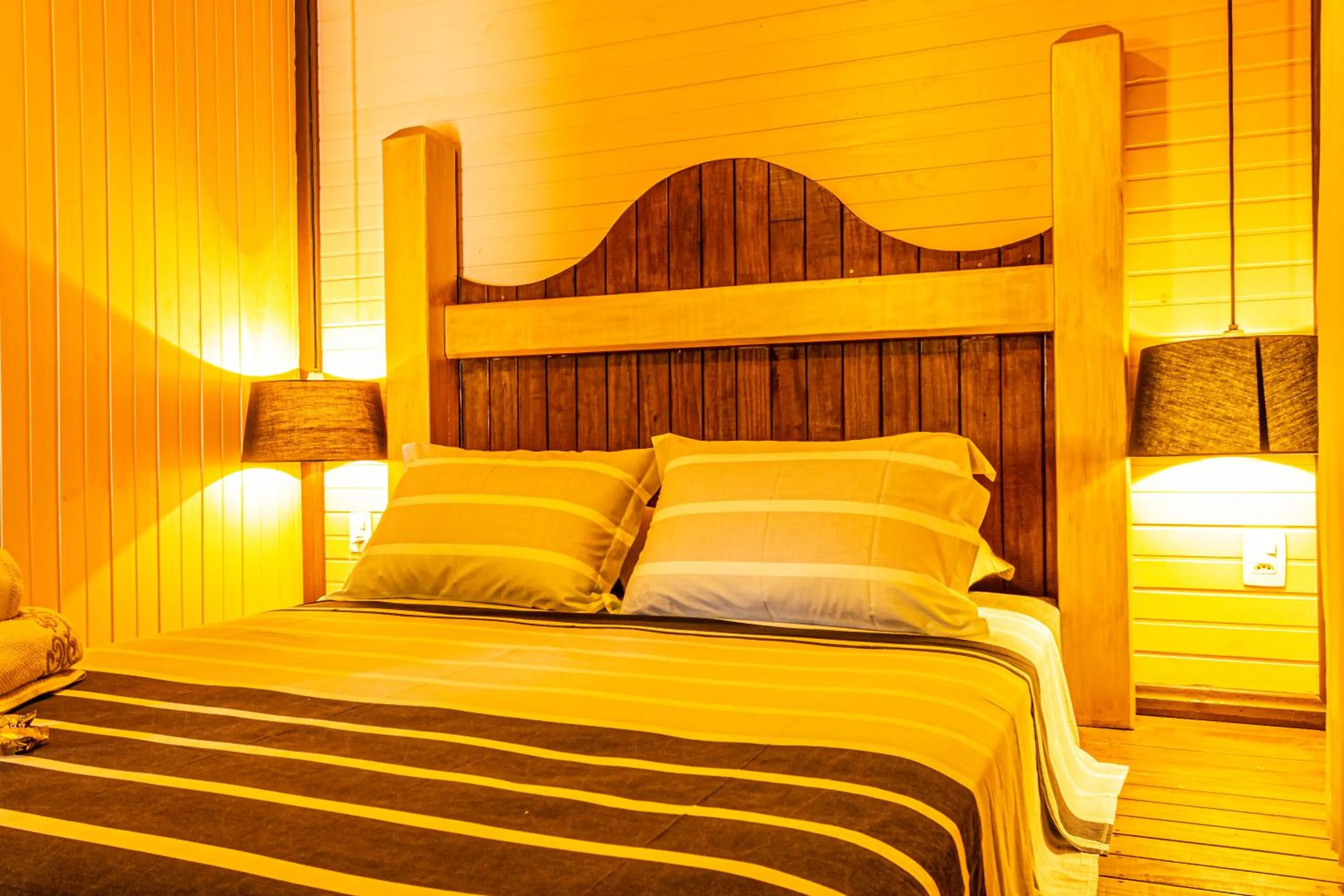 Property building, Bed in Pousada Casa do Oscar