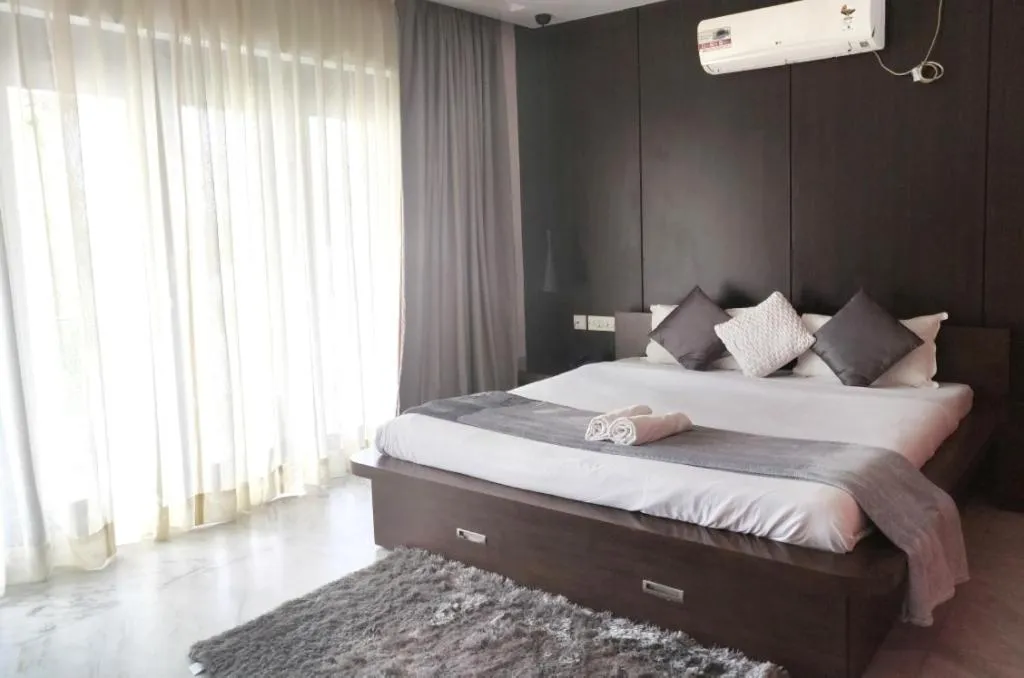 Photo of the whole room, Bed in Tatvam Residency