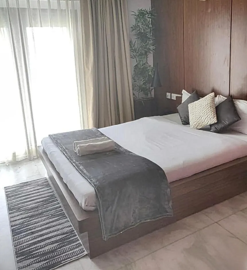 Bedroom, Bed in Tatvam Residency